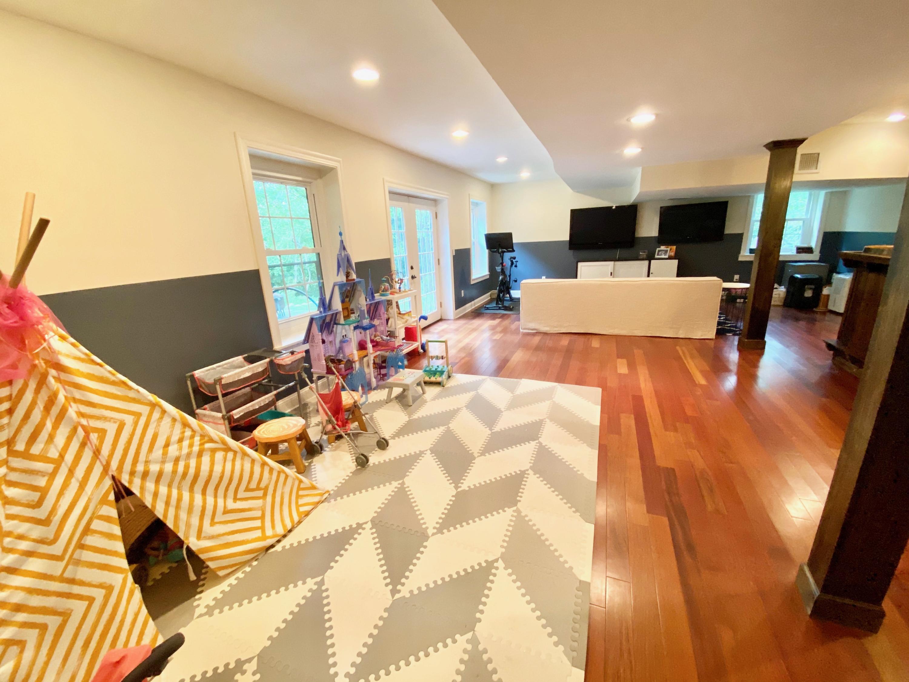 19 Clapboard Hill Road New Canaan, CT 06840 - Photo 27 of 30 a bed room with a bed and a view of kitchen