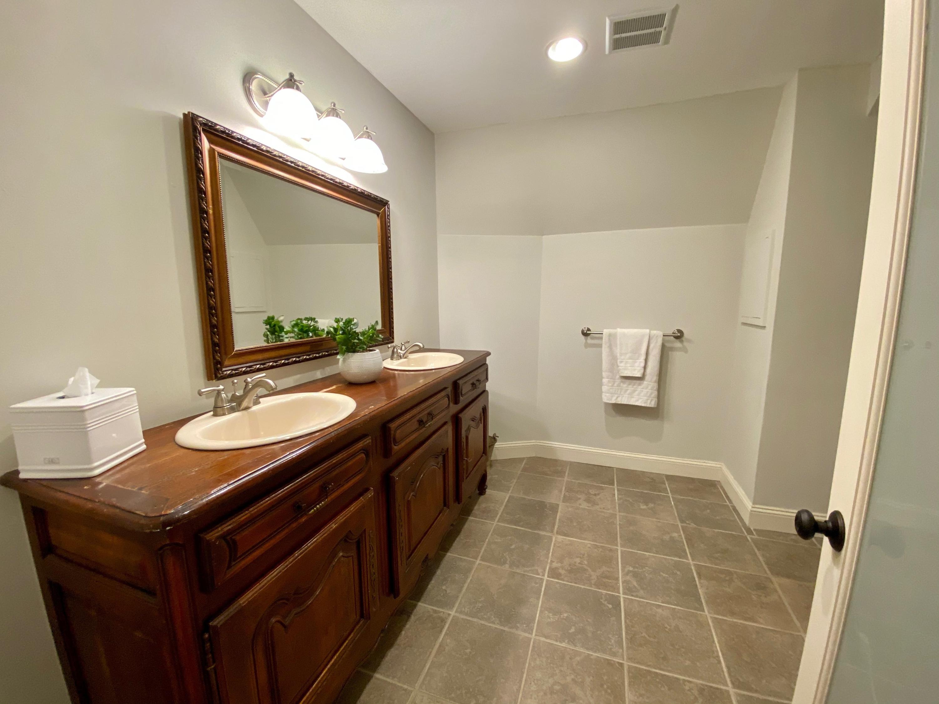 19 Clapboard Hill Road New Canaan, CT 06840 - Photo 28 of 30 a bathroom with a sink and a mirror