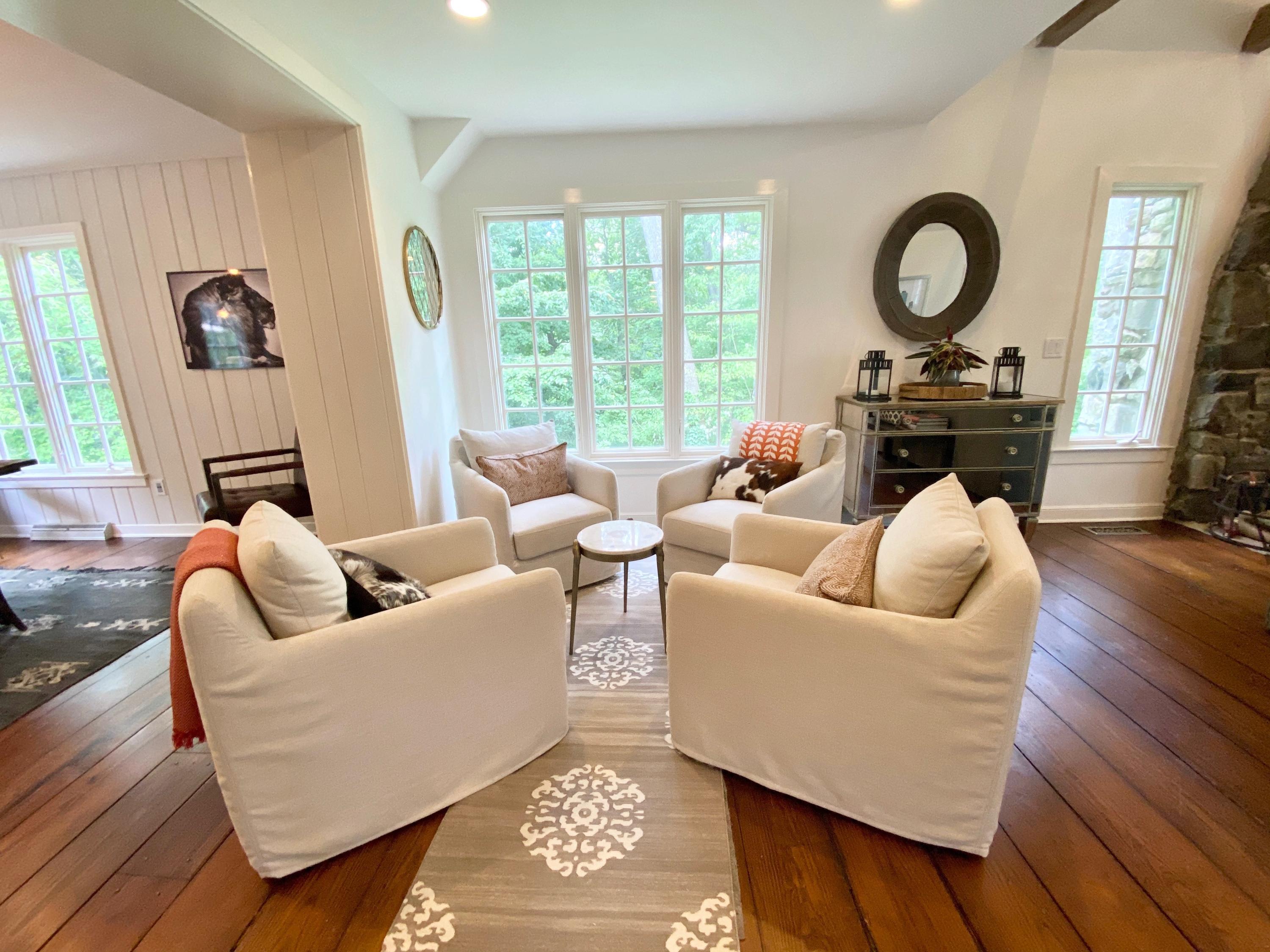 19 Clapboard Hill Road New Canaan, CT 06840 - Photo 5 of 30 a living room with furniture and a large window