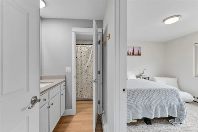 a en suite bathroom with a sink and a mirror