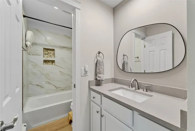 a bathroom with a sink and a mirror