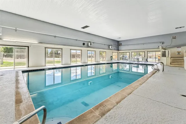 a view of a living room and kitchen with furniture