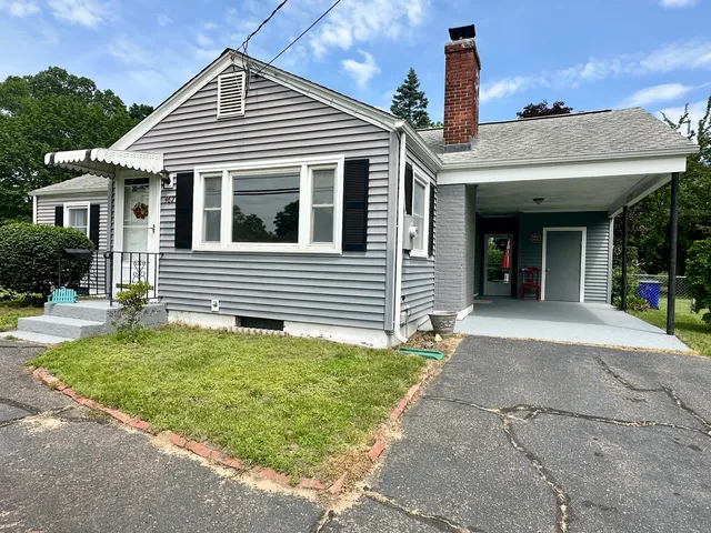 front view of a house with a yard