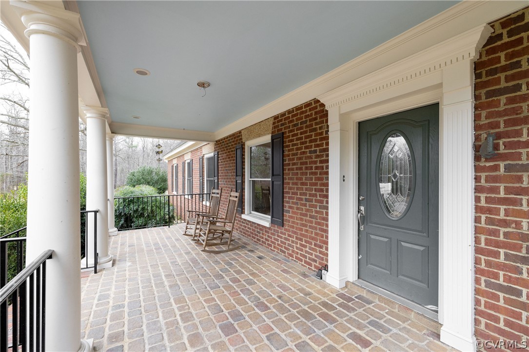 12602 Old Ridge Road Doswell, VA 23047 - Photo 4 of 37 Front porch with paver floor and new porch and step handrails