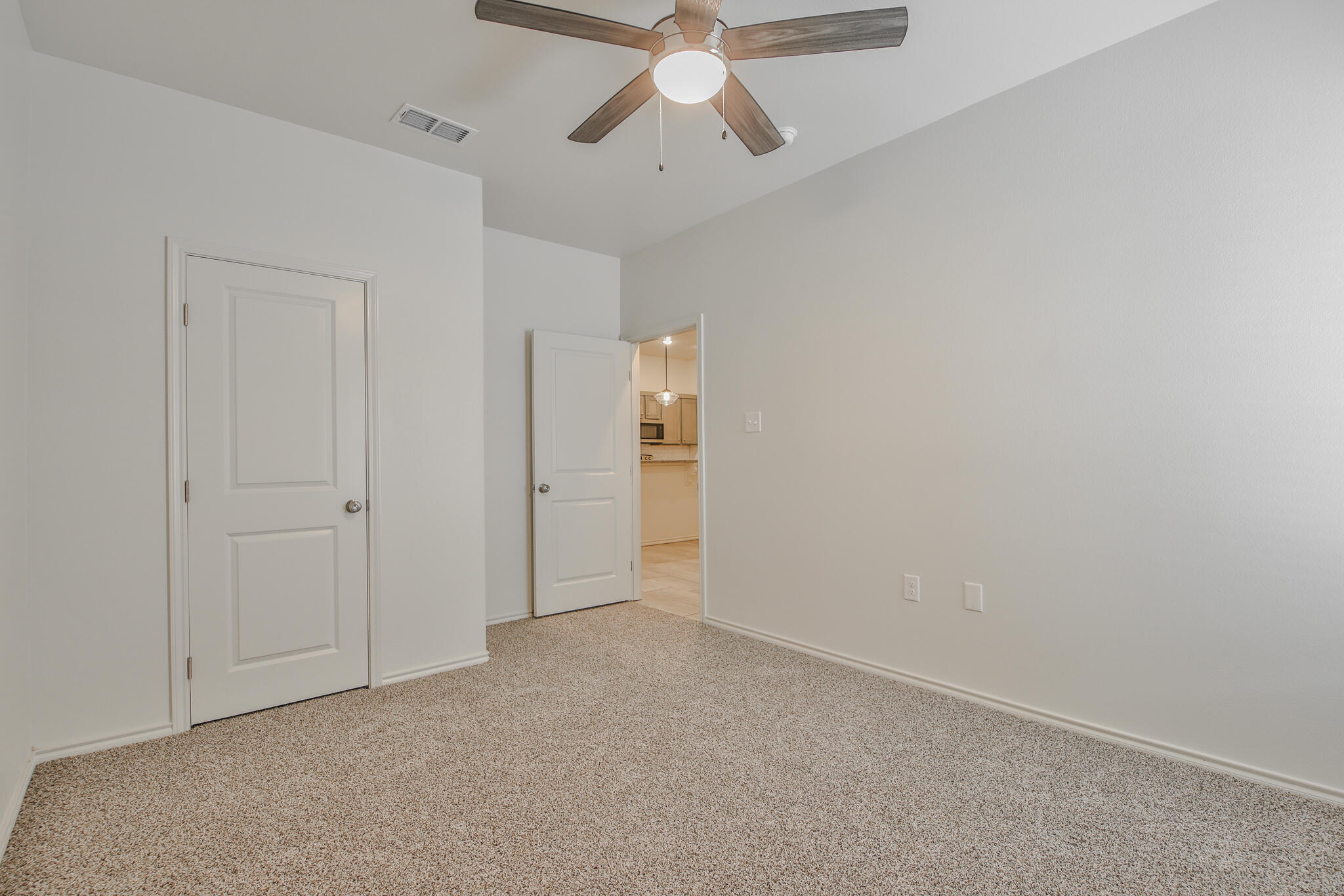 5512 Kemper Street Lubbock, TX 79416 - Photo 17 of 34 an empty room with chandelier fan