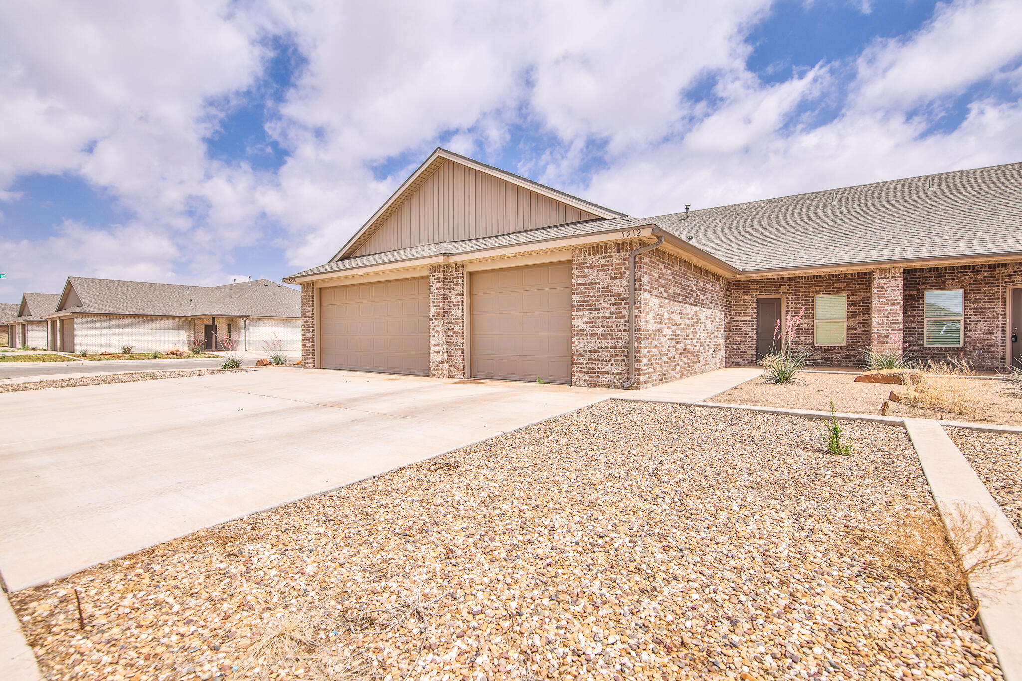 5512 Kemper Street Lubbock, TX 79416 - Photo 33 of 34 a spacious bathroom with a sink and a yard