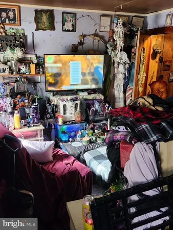 a room with lots of different colored cloths