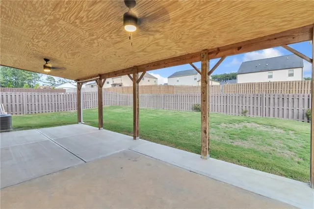 a view of a house with a yard and porch