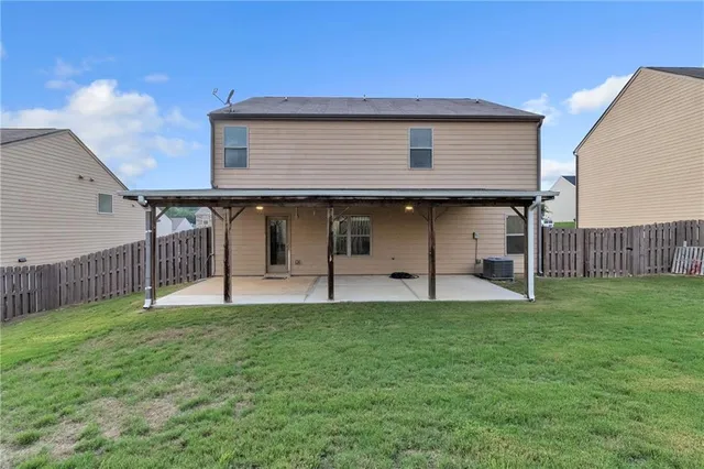 a house view with a backyard space