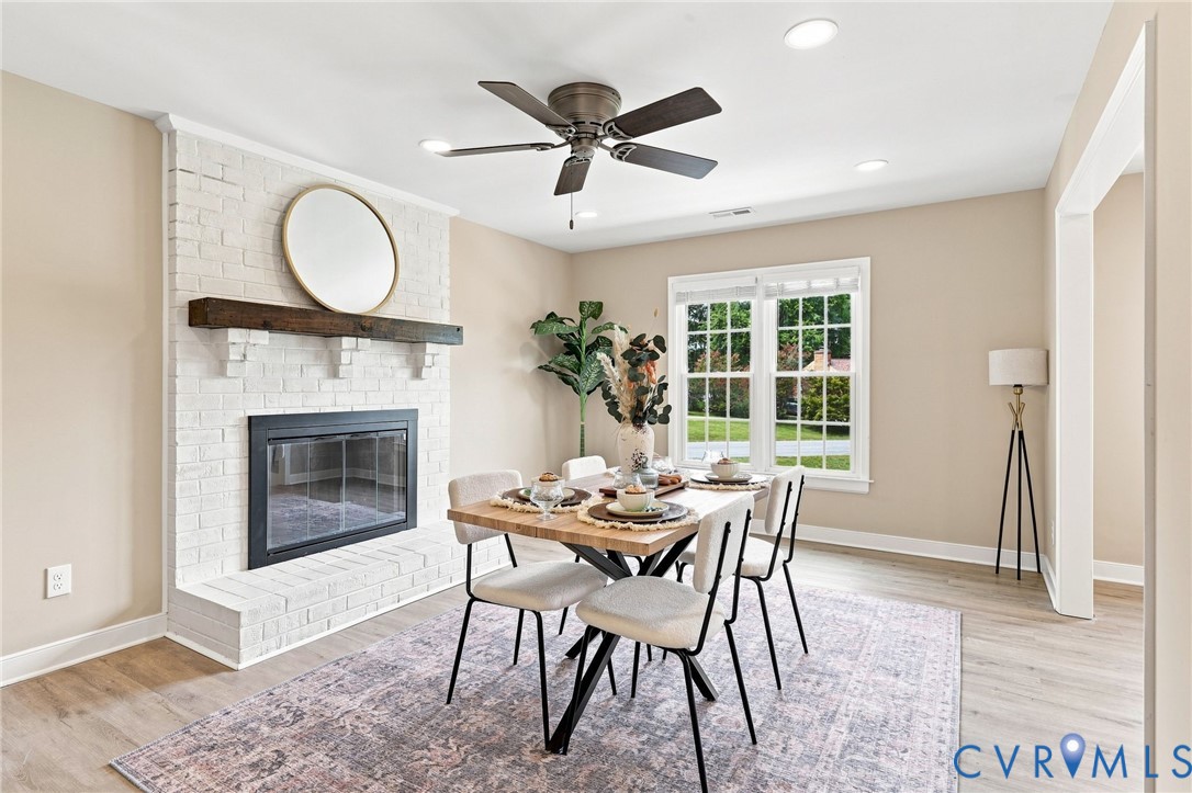 3221 Clintwood Road Midlothian, VA 23112 - Photo 15 of 46 White brick fireplace with dark wood mantel, wood-