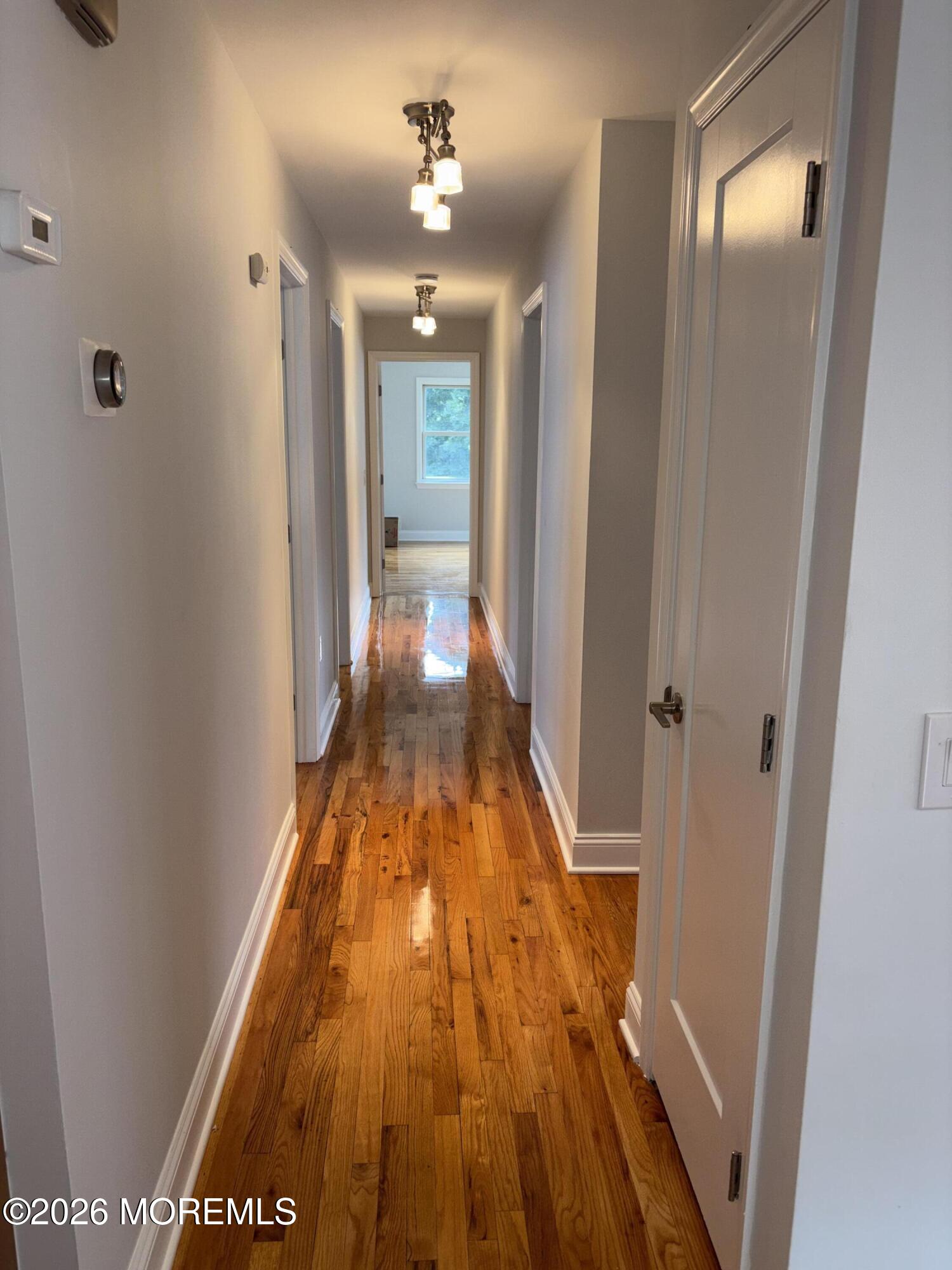 274 Spring Street, Unit A Red Bank, NJ 07701 - Photo 12 of 28 Hall leads to rest of apartment