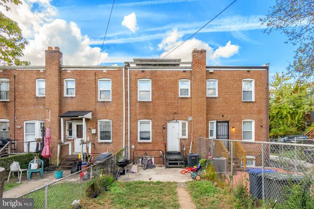 a front view of a building with many windows