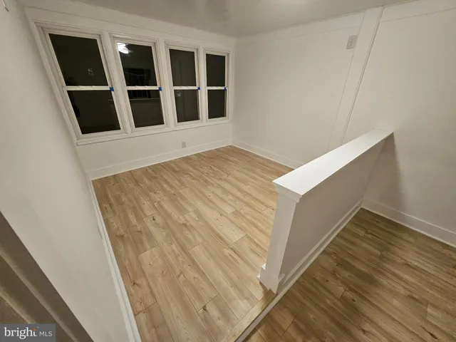 a view of wooden floor and entryway