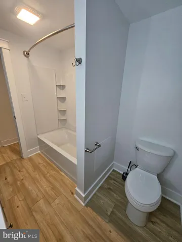 a bathroom with a sink vanity and mirror