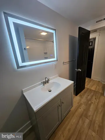 a bathroom with a tub and a shower