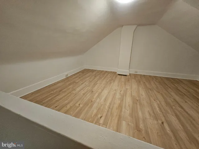 a view of wooden floor in an empty room