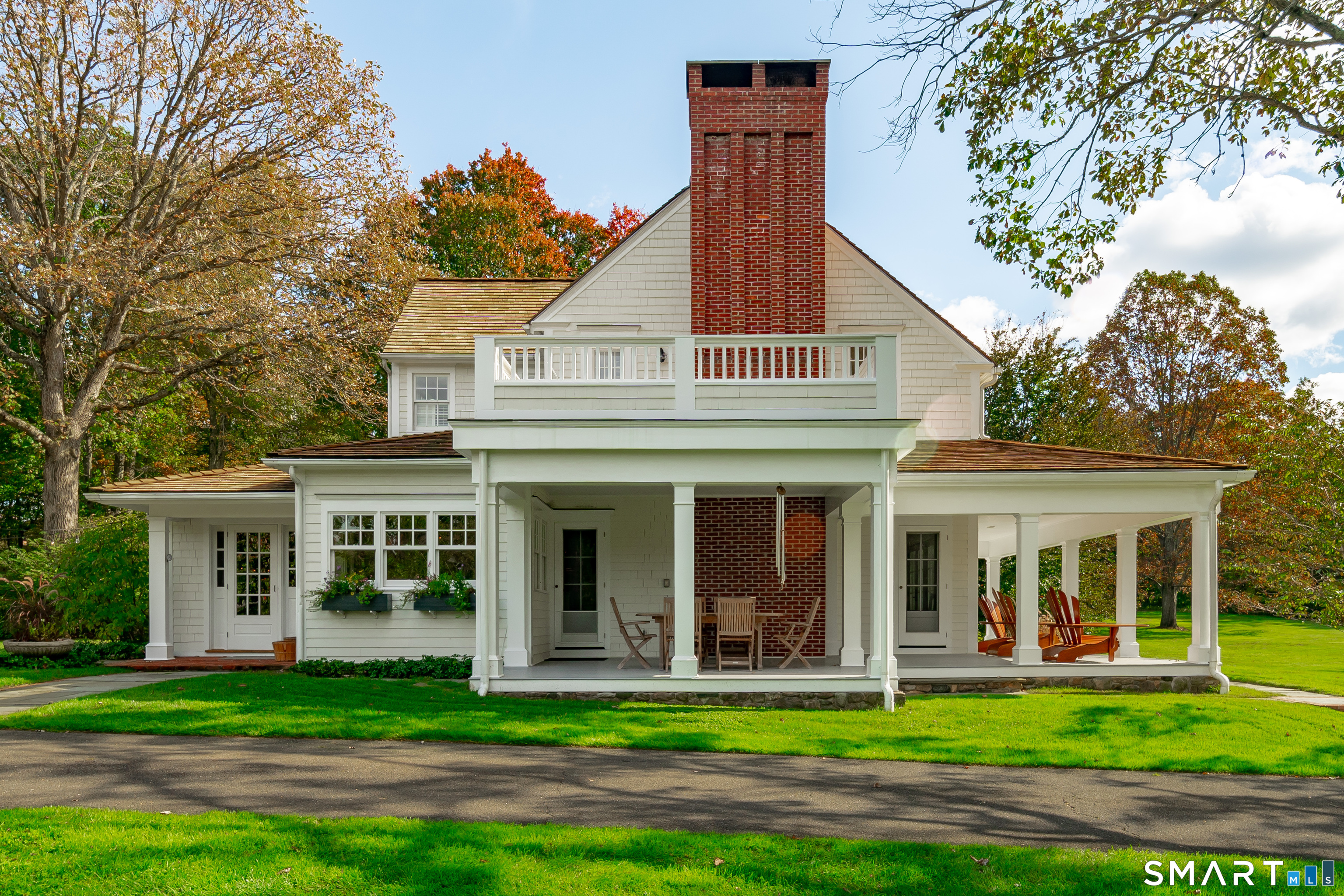 198 Hemlock Hill Road New Canaan, CT 06840 - Photo 12 of 32 front view of a house with a yard