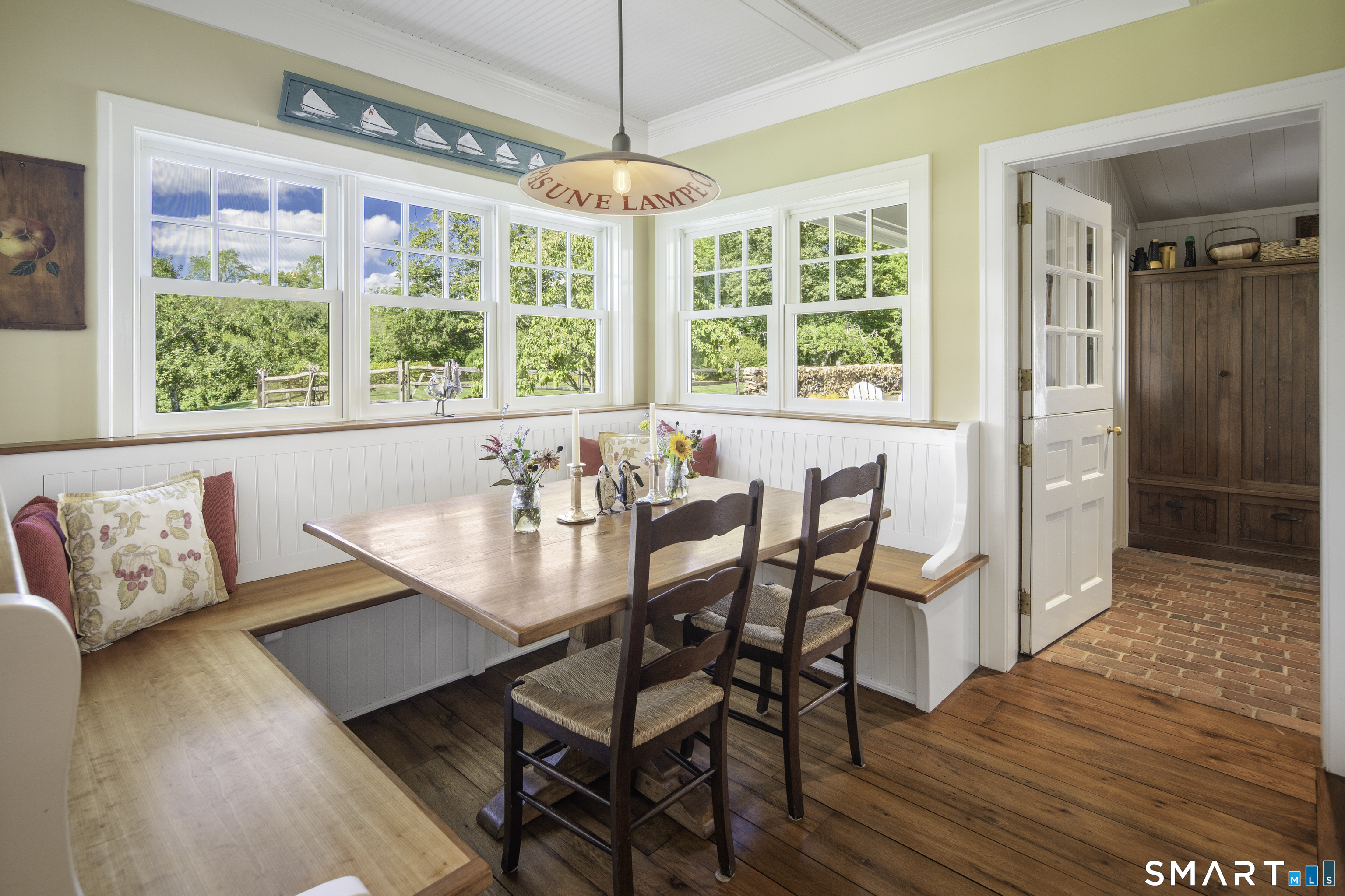 198 Hemlock Hill Road New Canaan, CT 06840 - Photo 16 of 32 a view of a dining room with furniture window and wooden floor