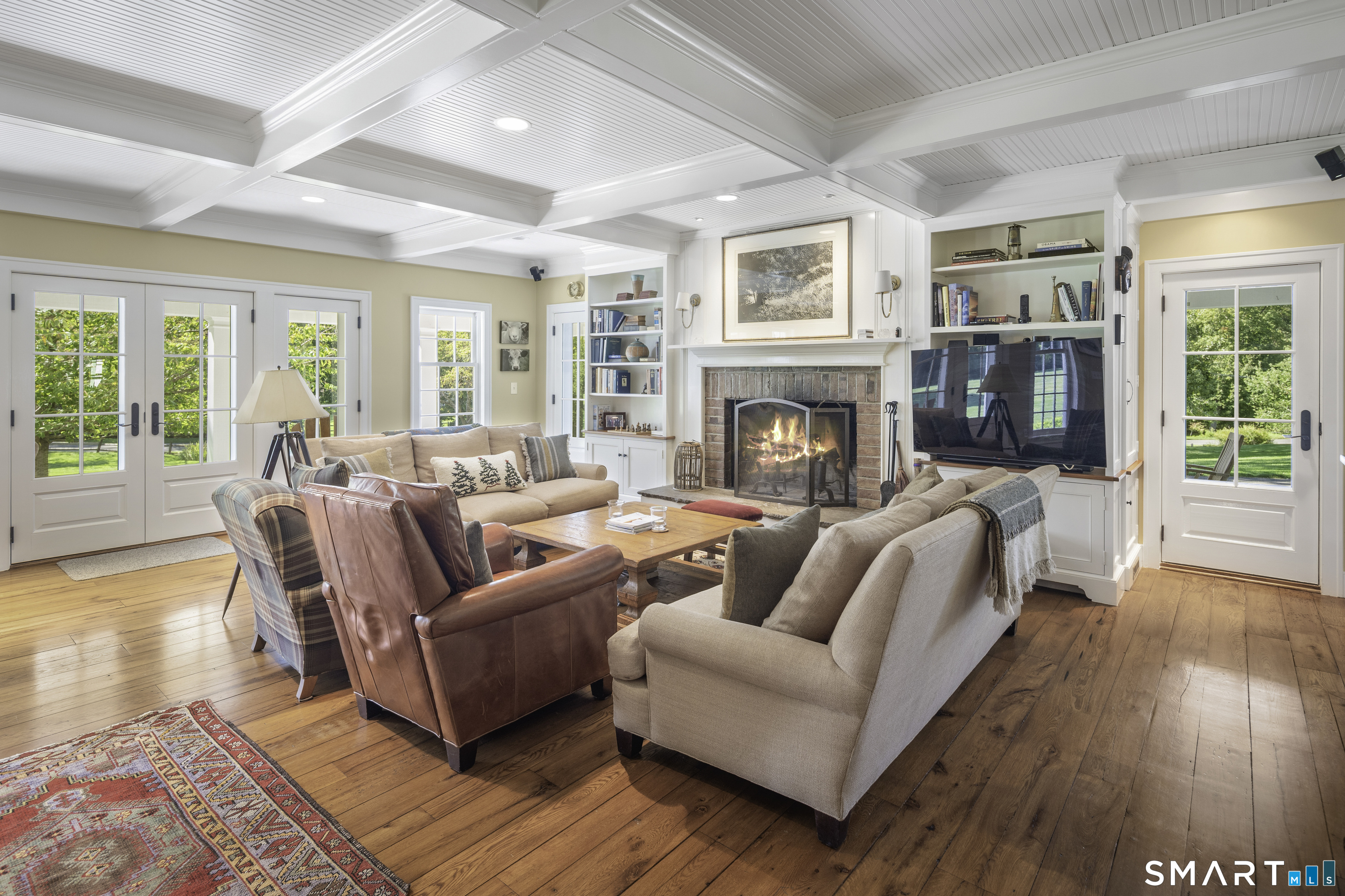 198 Hemlock Hill Road New Canaan, CT 06840 - Photo 18 of 32 a living room with furniture and a fireplace