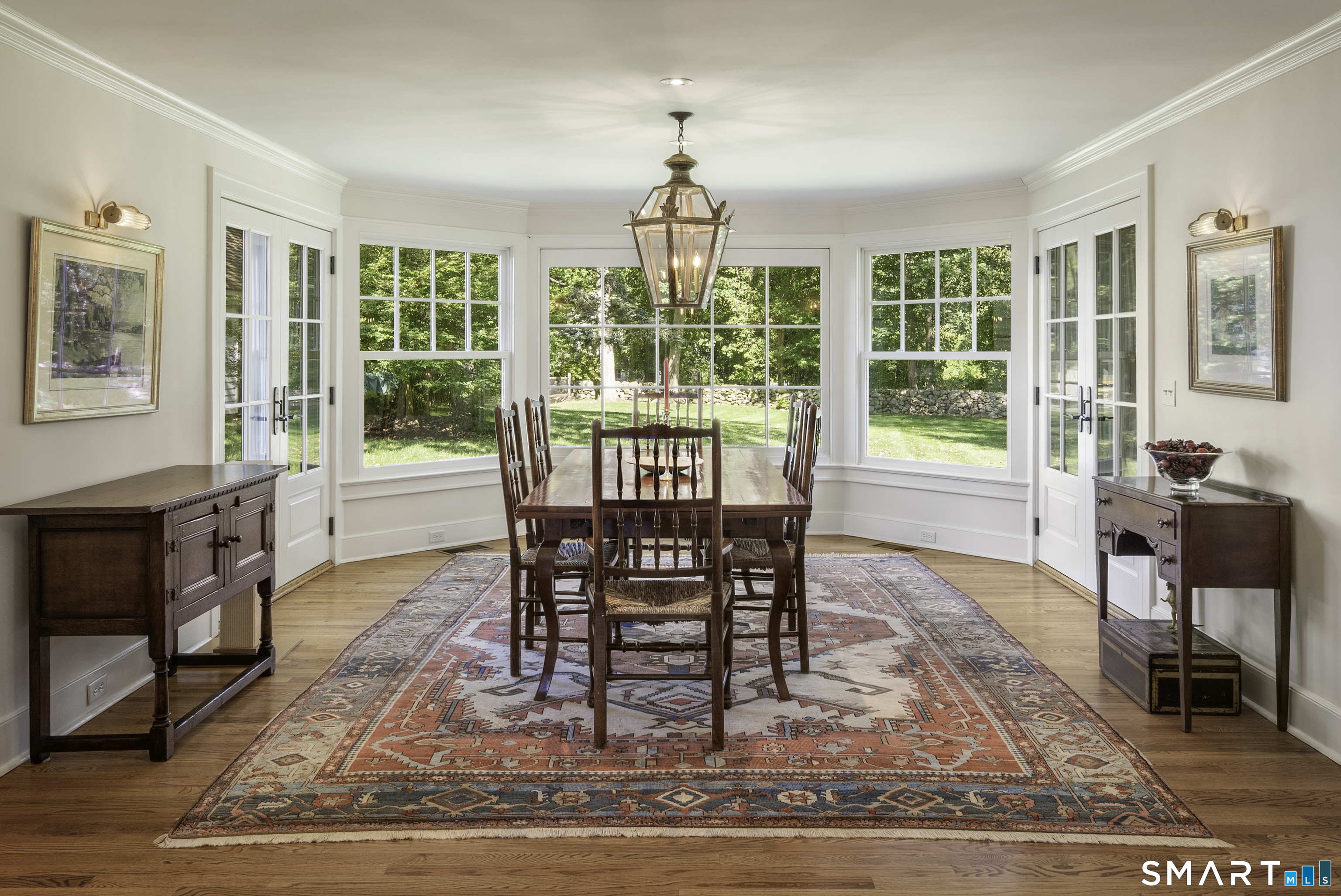 198 Hemlock Hill Road New Canaan, CT 06840 - Photo 19 of 32 a view of a dining room with furniture window and wooden floor