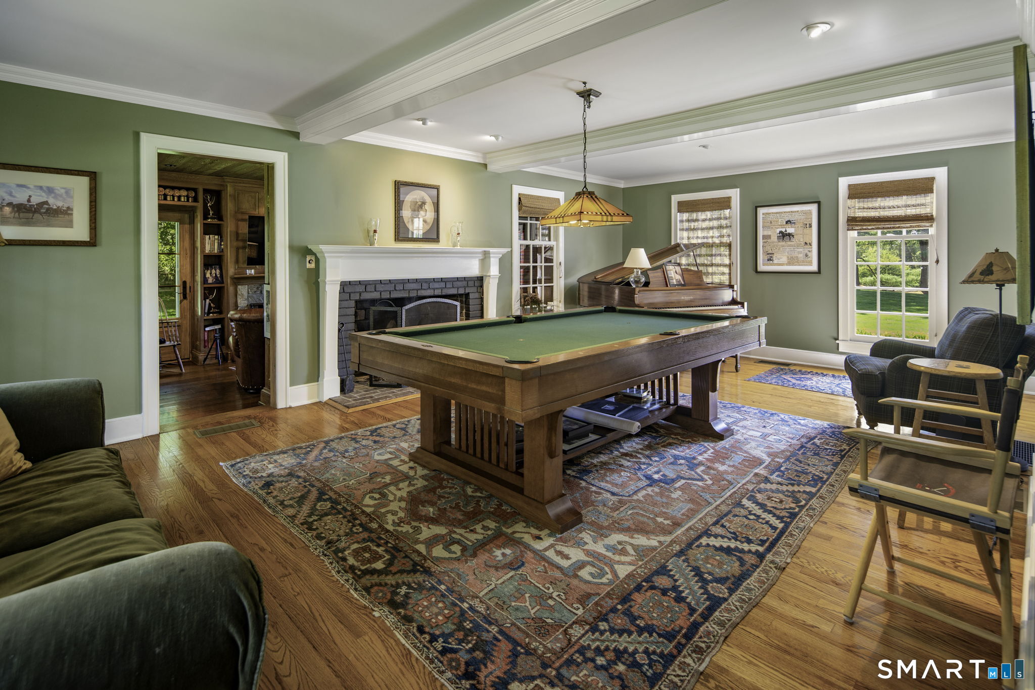 198 Hemlock Hill Road New Canaan, CT 06840 - Photo 21 of 32 a living room with furniture pool table and a fireplace