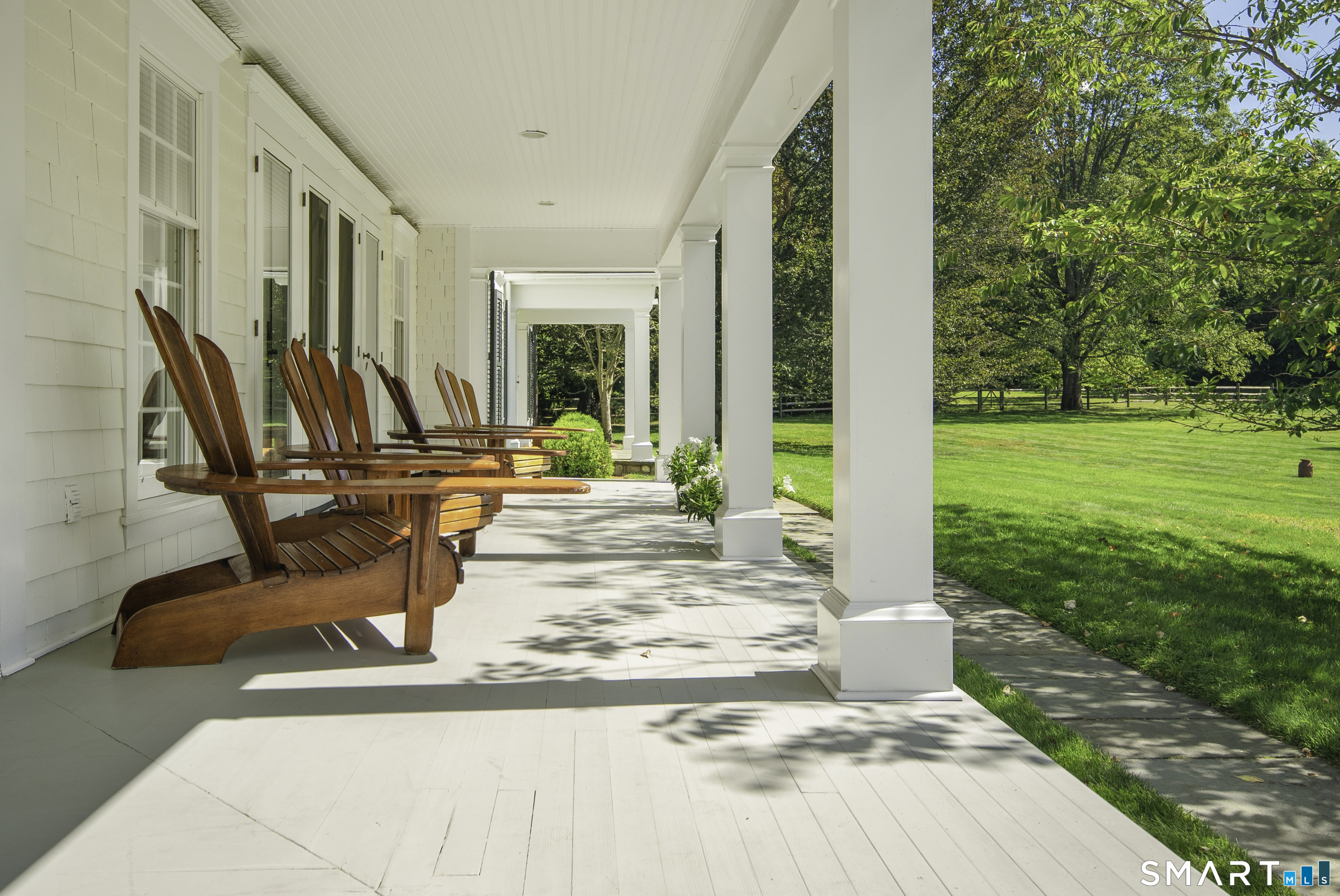 198 Hemlock Hill Road New Canaan, CT 06840 - Photo 21 of 32 a view of a patio with chairs and plants
