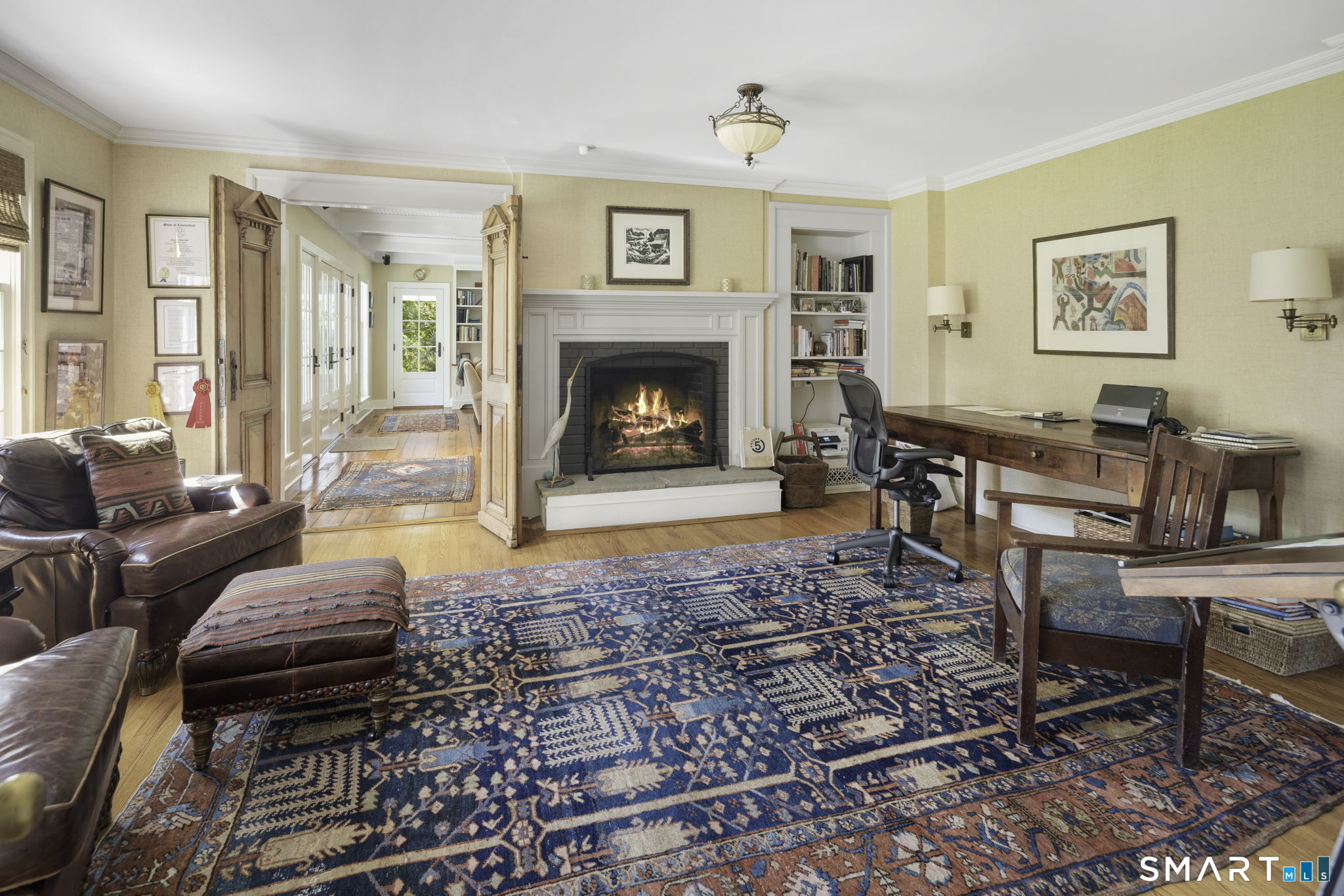 198 Hemlock Hill Road New Canaan, CT 06840 - Photo 22 of 32 a living room with furniture and a fireplace