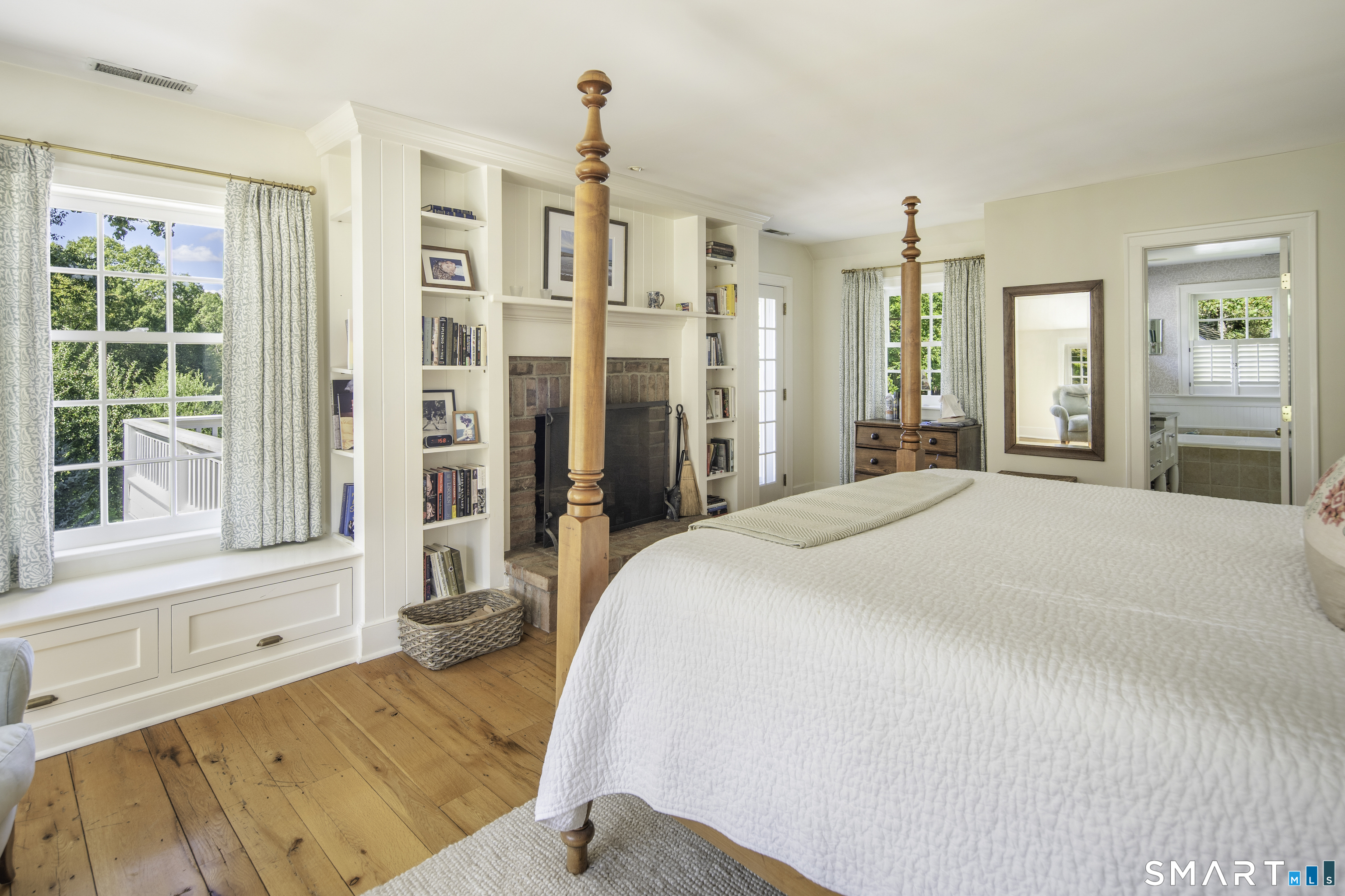198 Hemlock Hill Road New Canaan, CT 06840 - Photo 24 of 32 a spacious bedroom with a large bed and a large window