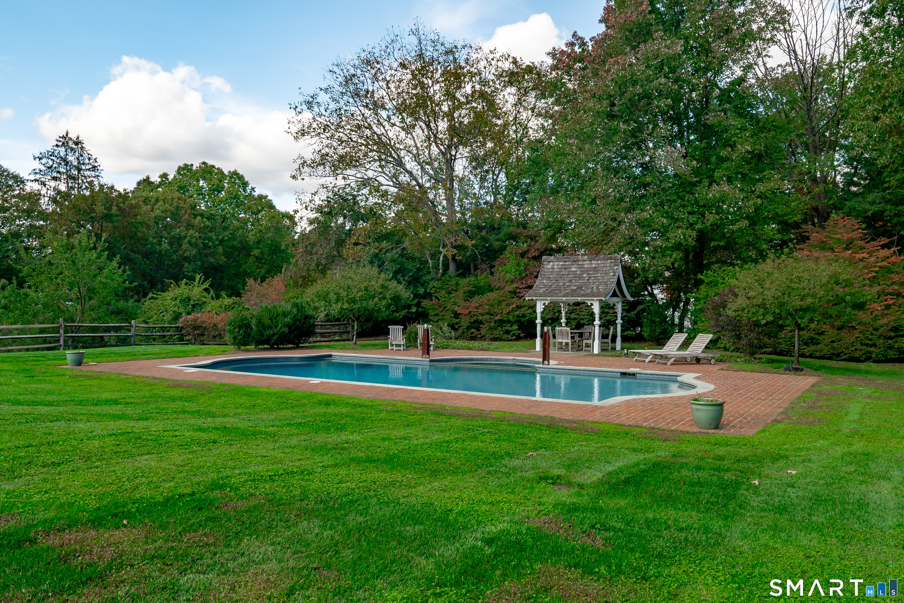 198 Hemlock Hill Road New Canaan, CT 06840 - Photo 8 of 32 a view of a swimming pool with a yard
