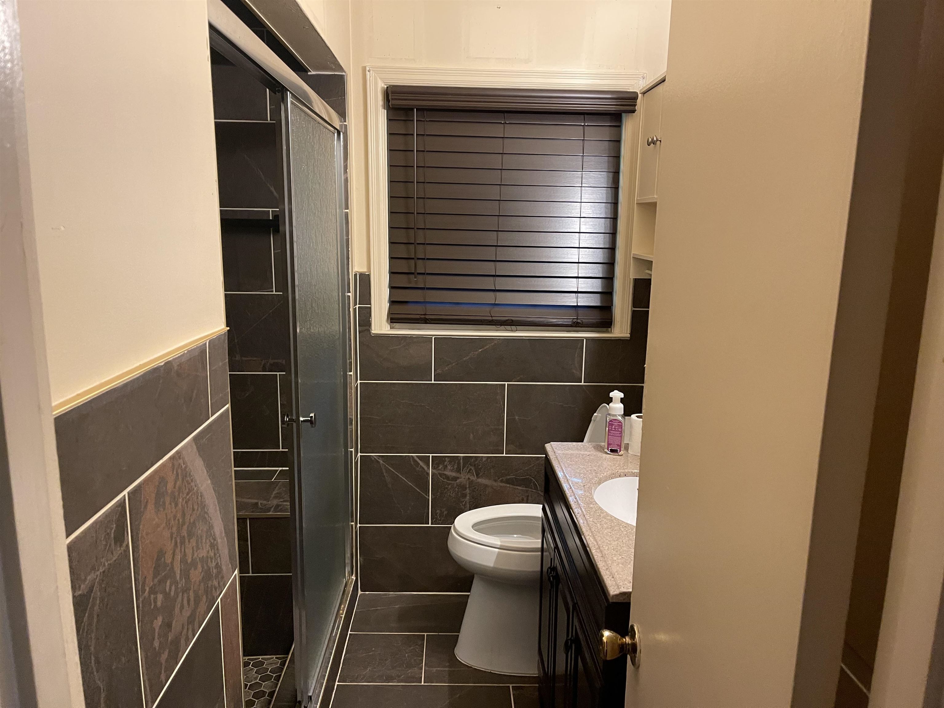 895 Enfield Road Memphis, TN 38116 - Photo 7 of 9 a bathroom with a toilet and a shower