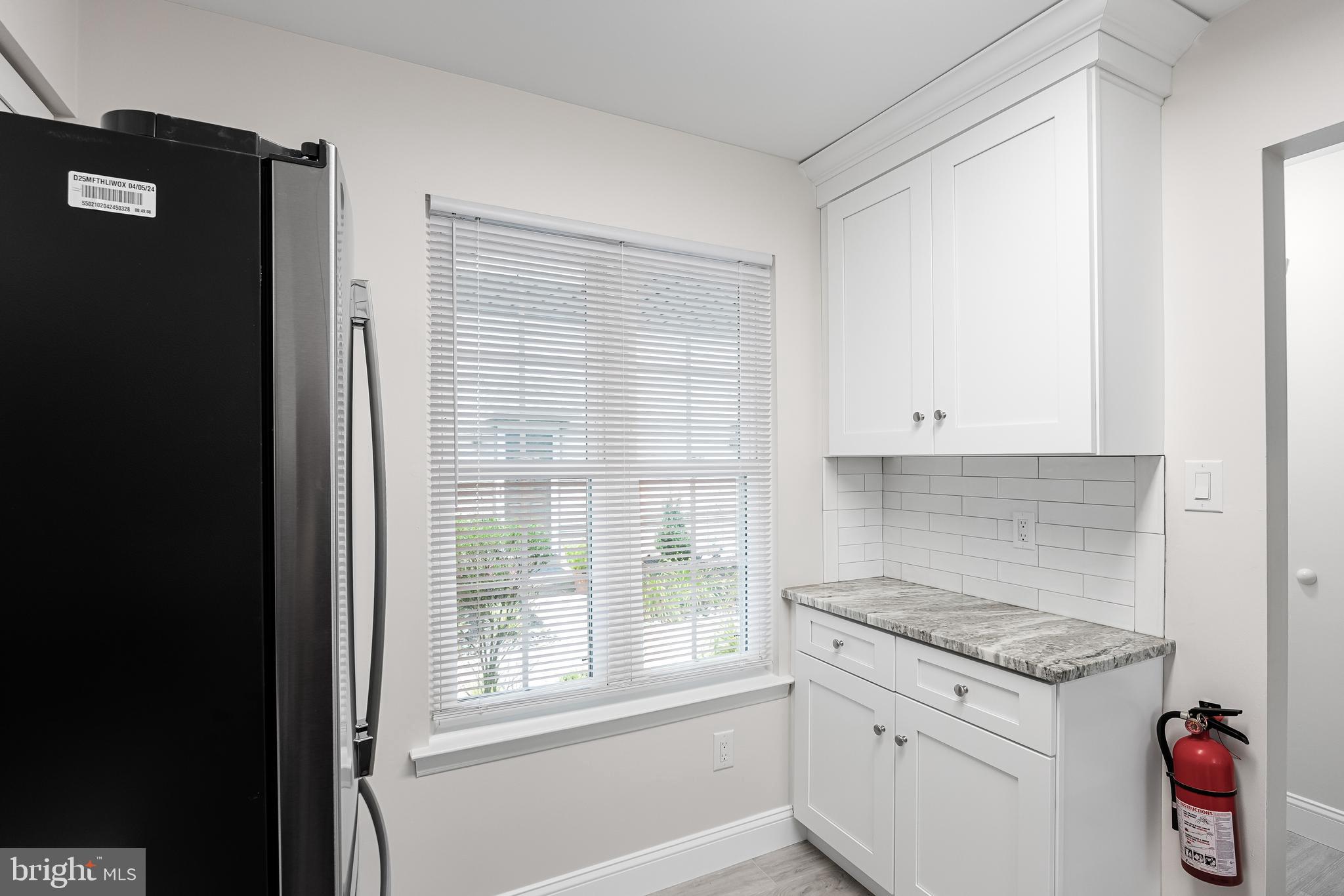 5003 A Albridge Way Mount Laurel, NJ 08054 - Photo 15 of 28 a kitchen with granite countertop a stove a sink and a refrigerator