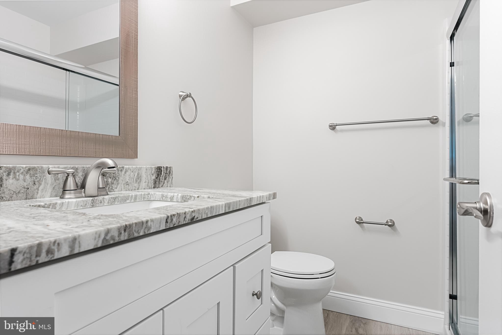 5003 A Albridge Way Mount Laurel, NJ 08054 - Photo 22 of 28 a bathroom with a granite countertop sink a toilet and a mirror