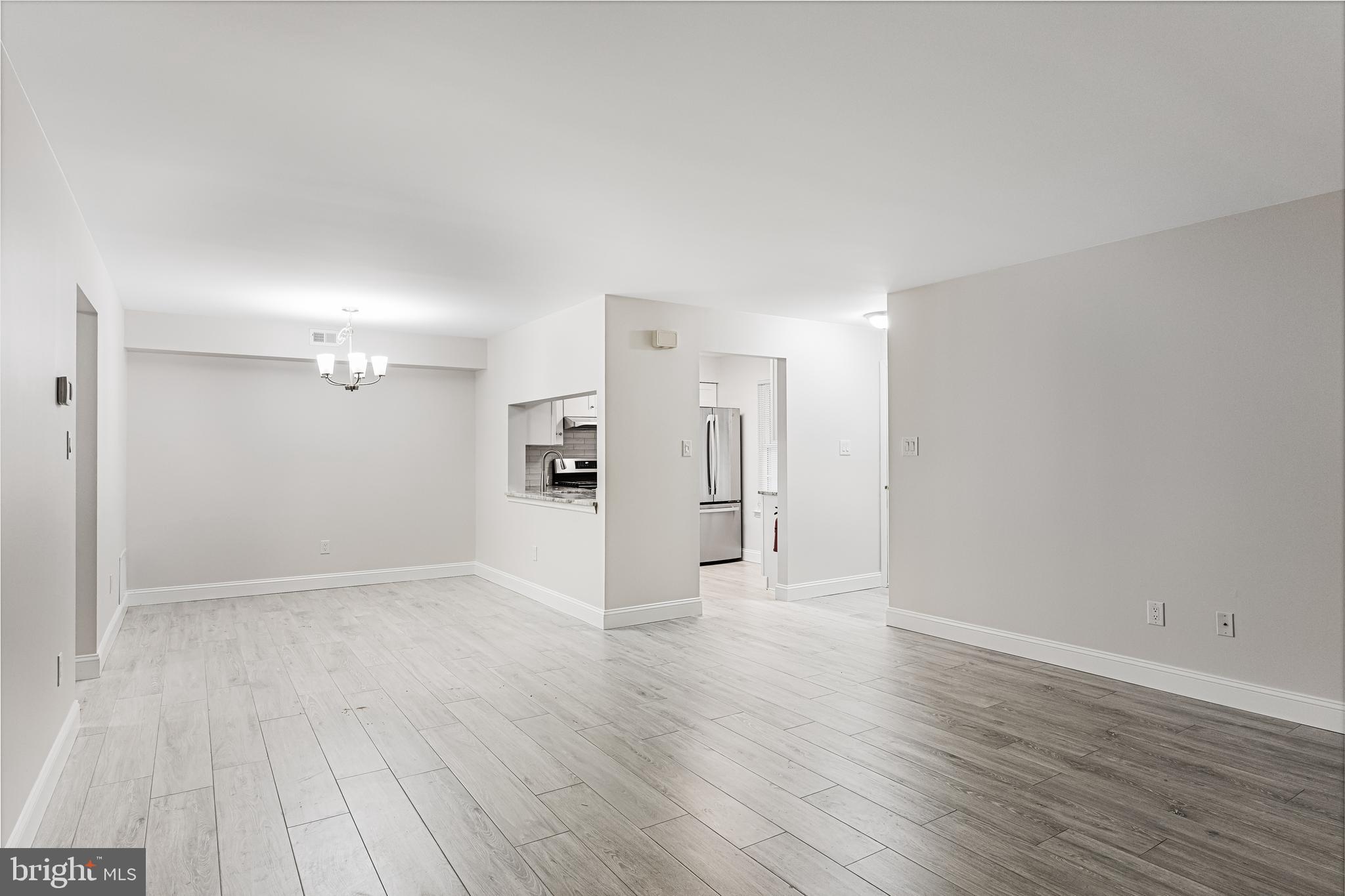 5003 A Albridge Way Mount Laurel, NJ 08054 - Photo 9 of 28 a view of an empty room with wooden floor