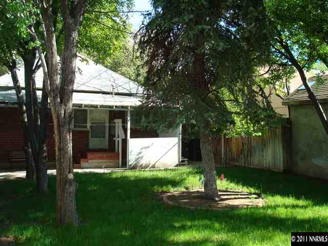 135 La Rue Avenue Reno, NV 89509 - Photo 11 of 12 a view of backyard with table and chairs and a large tree