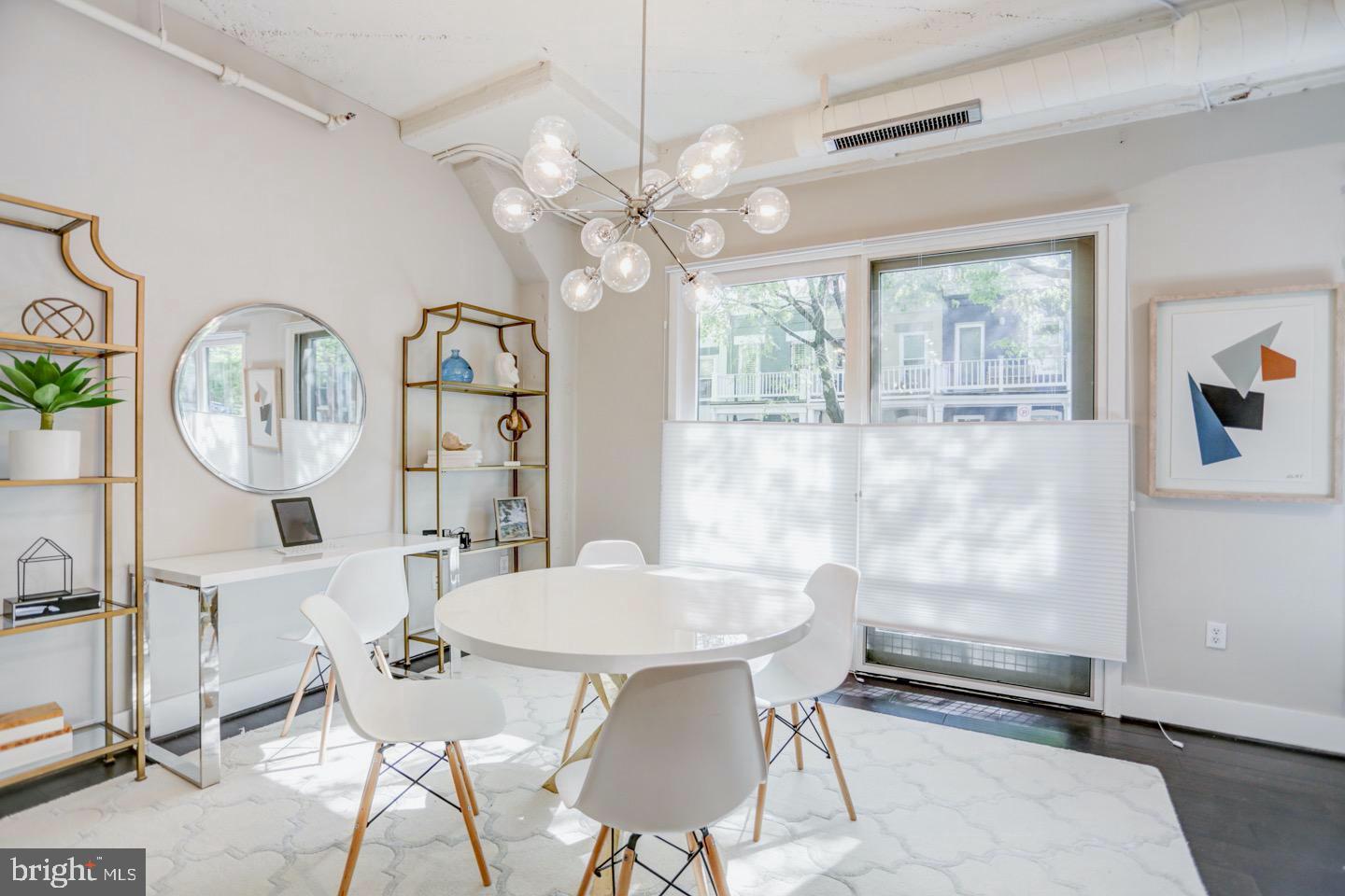 1700 Kalorama Road Northwest, Unit 207 Washington, DC 20009 - Photo 11 of 34 a view of a dining room with furniture and chandelier