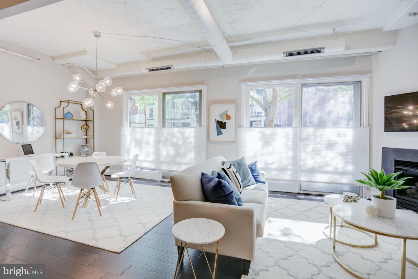 1700 Kalorama Road Northwest, Unit 207 Washington, DC 20009 - Photo 14 of 34 a living room with furniture and a large window