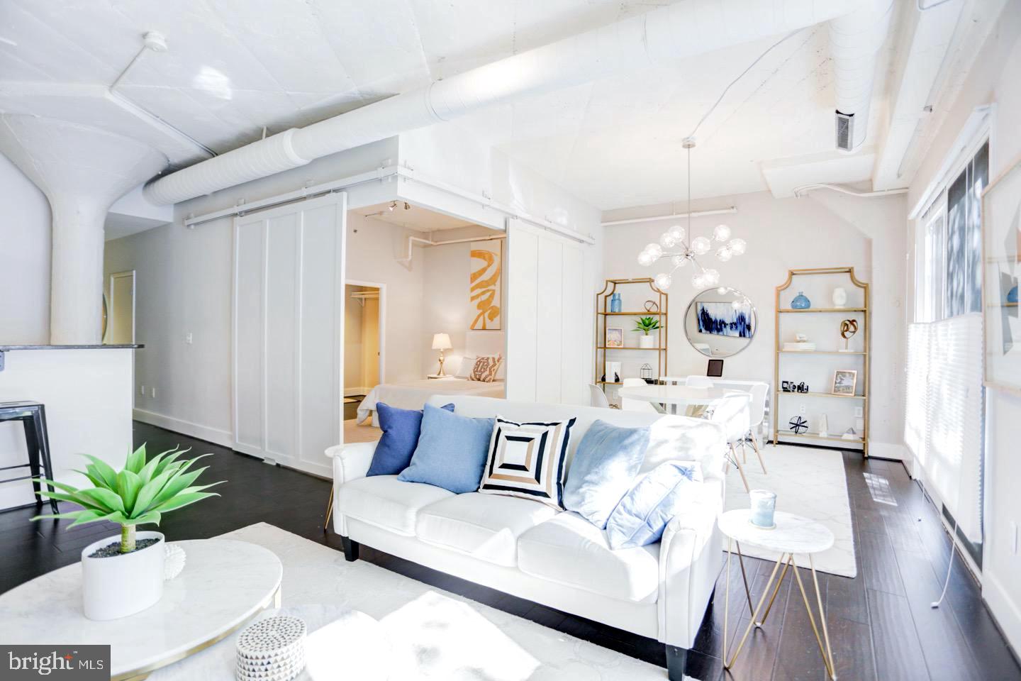 1700 Kalorama Road Northwest, Unit 207 Washington, DC 20009 - Photo 2 of 34 a living room with furniture and wooden floor