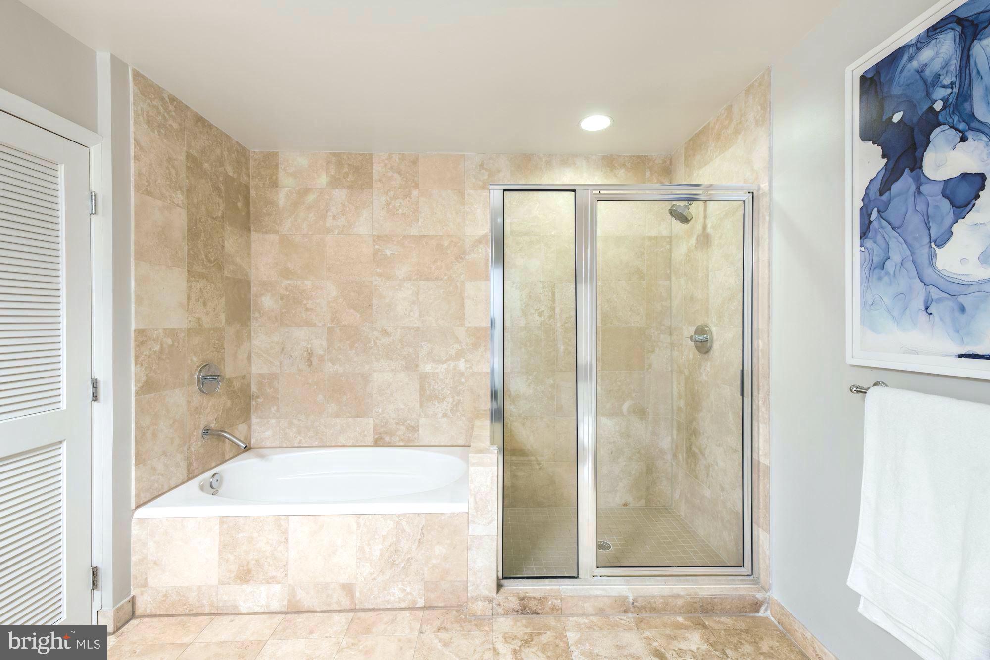 1700 Kalorama Road Northwest, Unit 207 Washington, DC 20009 - Photo 21 of 34 a bathroom with a bathtub and shower