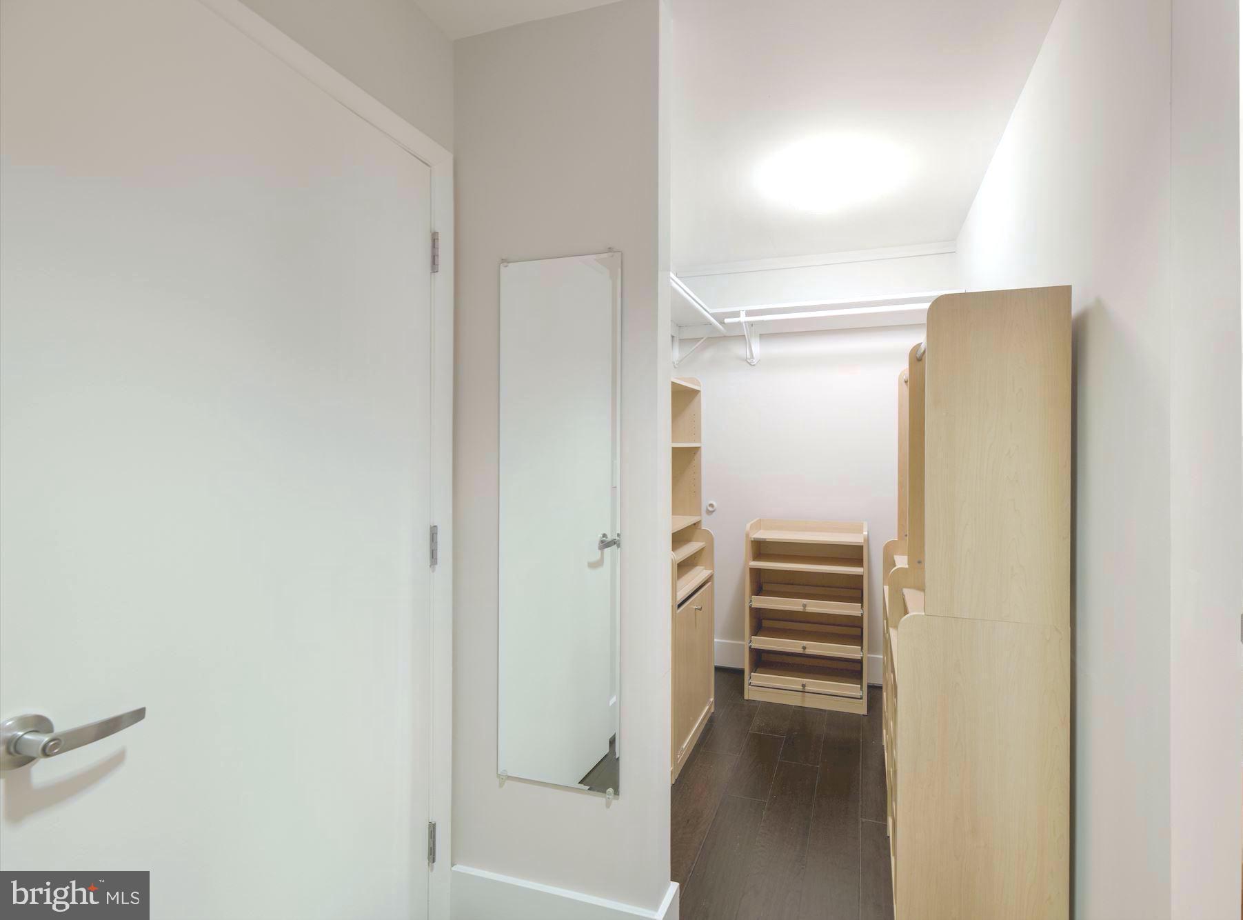 1700 Kalorama Road Northwest, Unit 207 Washington, DC 20009 - Photo 22 of 34 a view of walk in closet with empty racks