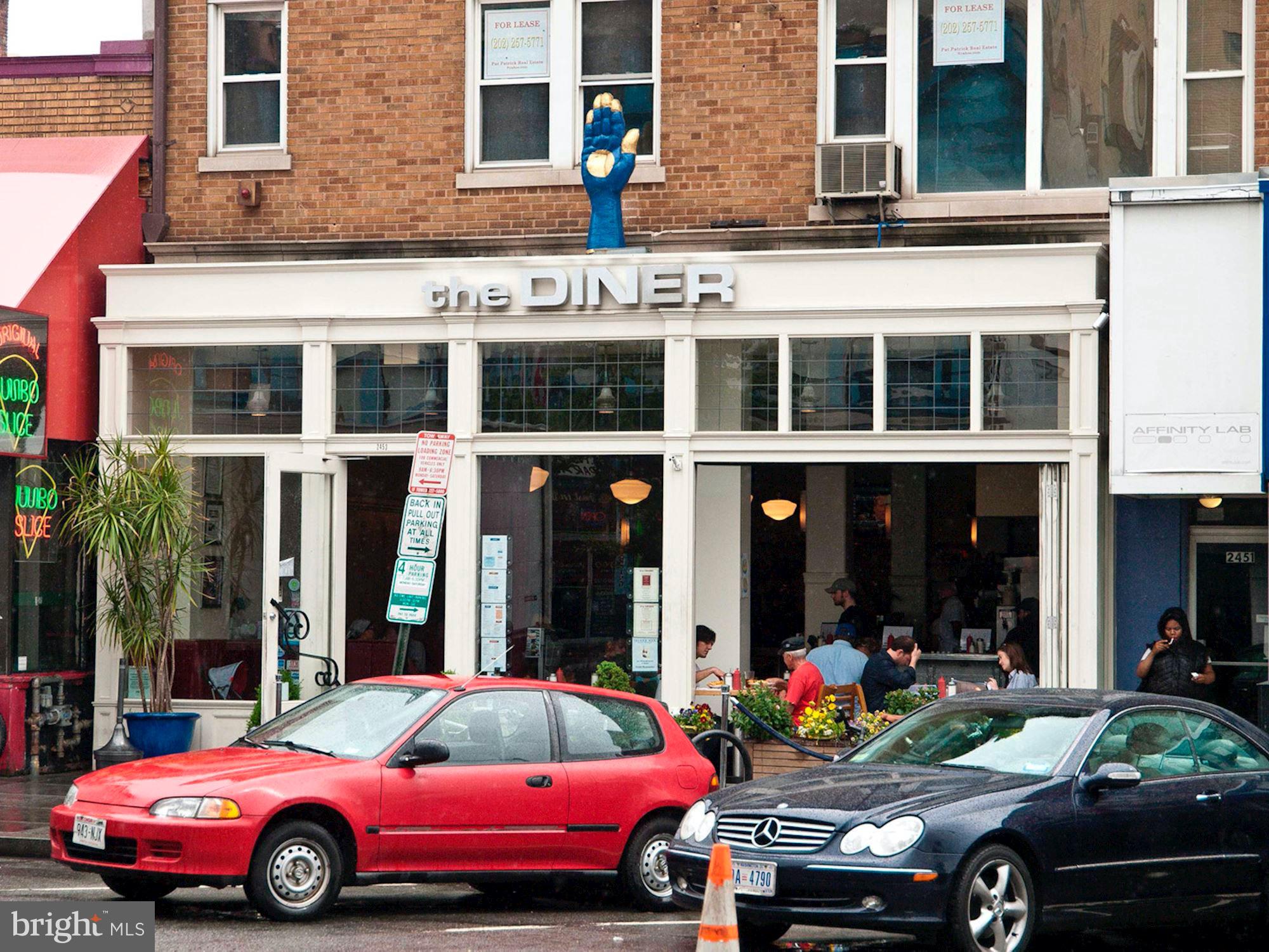 1700 Kalorama Road Northwest, Unit 207 Washington, DC 20009 - Photo 33 of 34 a car parked in front of a building