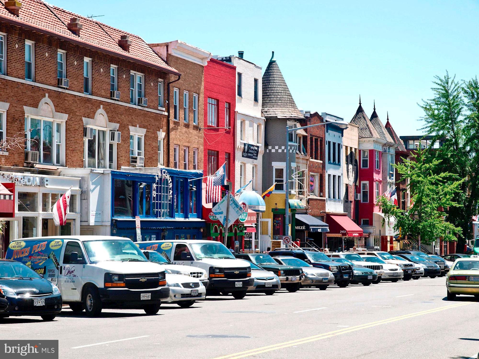 1700 Kalorama Road Northwest, Unit 207 Washington, DC 20009 - Photo 34 of 34 a car parked in front of a red brick building
