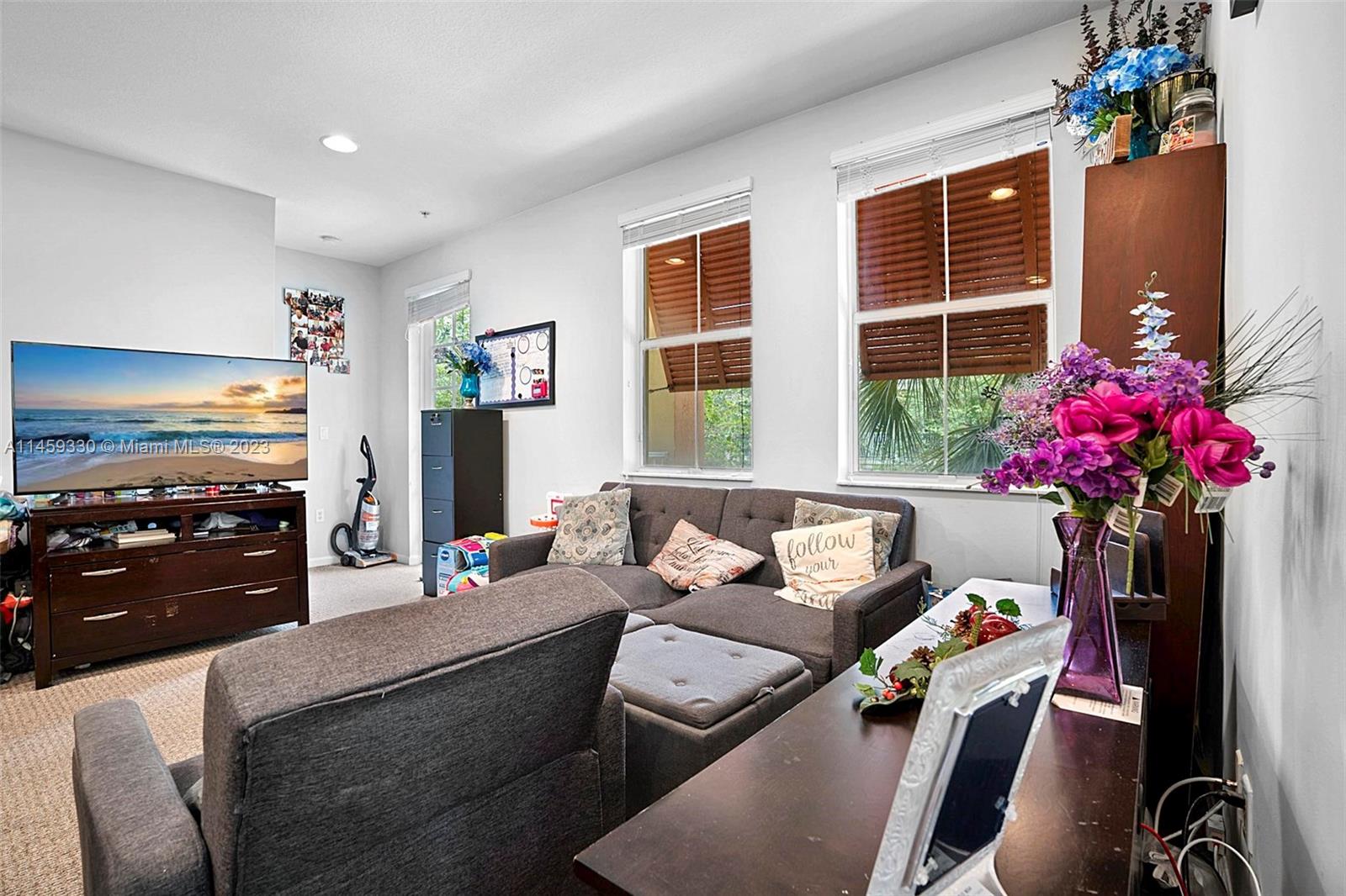 3920 Passion Flower Road Coconut Creek, FL 33073 - Photo 13 of 37 a living room with furniture and flowers