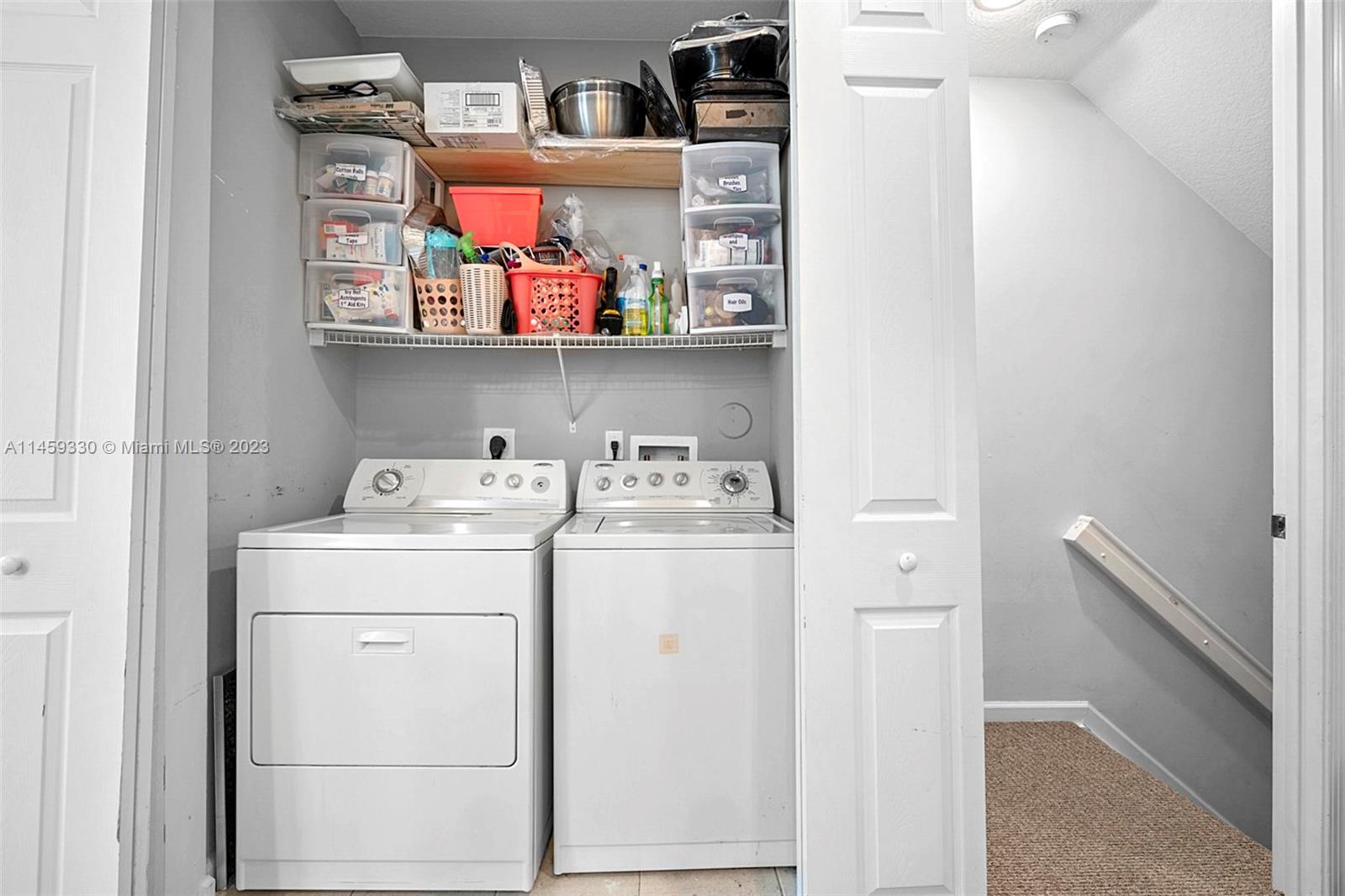 3920 Passion Flower Road Coconut Creek, FL 33073 - Photo 16 of 37 a utility room with dryer and washer