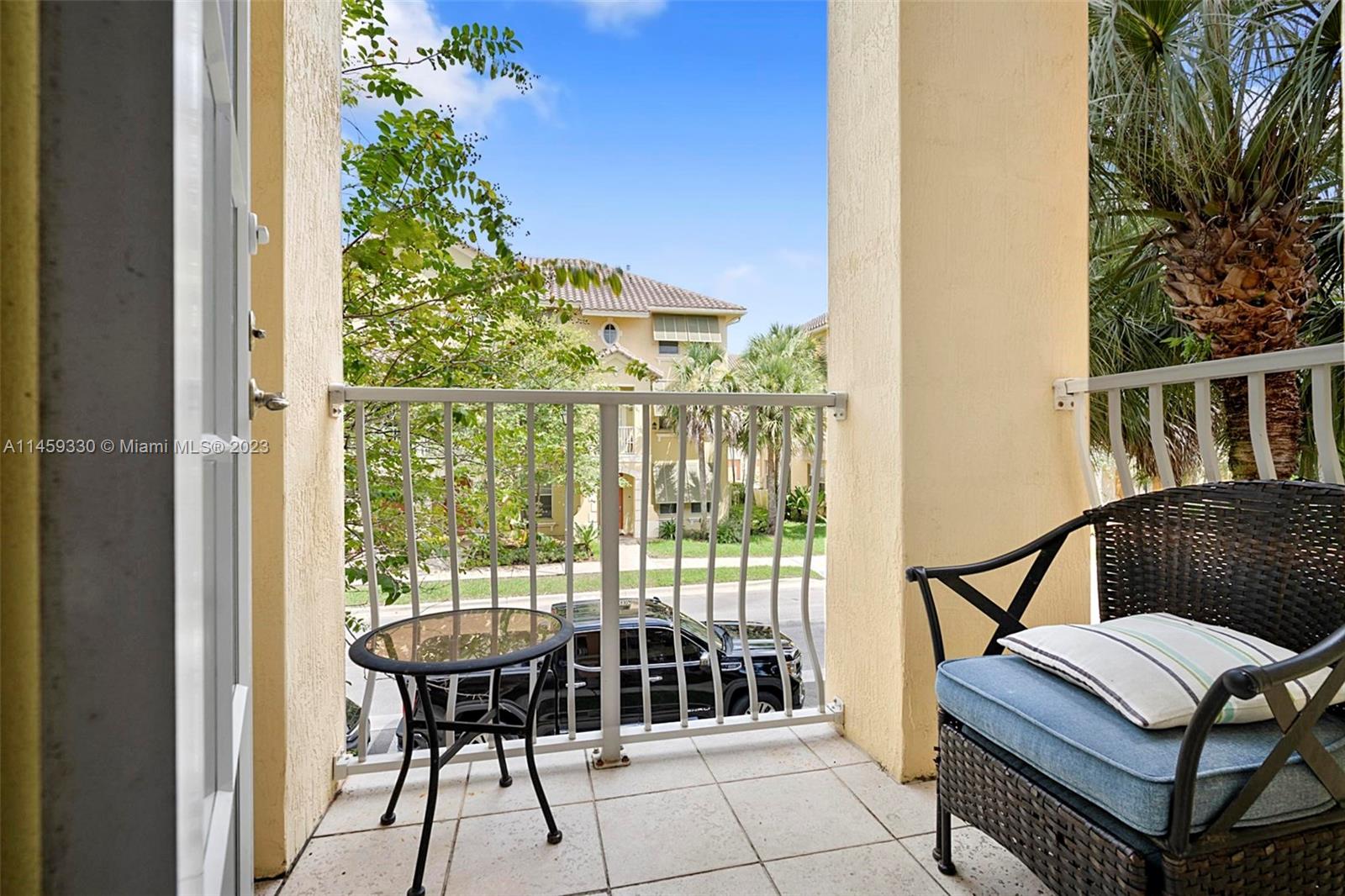 3920 Passion Flower Road Coconut Creek, FL 33073 - Photo 17 of 37 a view of balcony with a potted plant and outdoor seating
