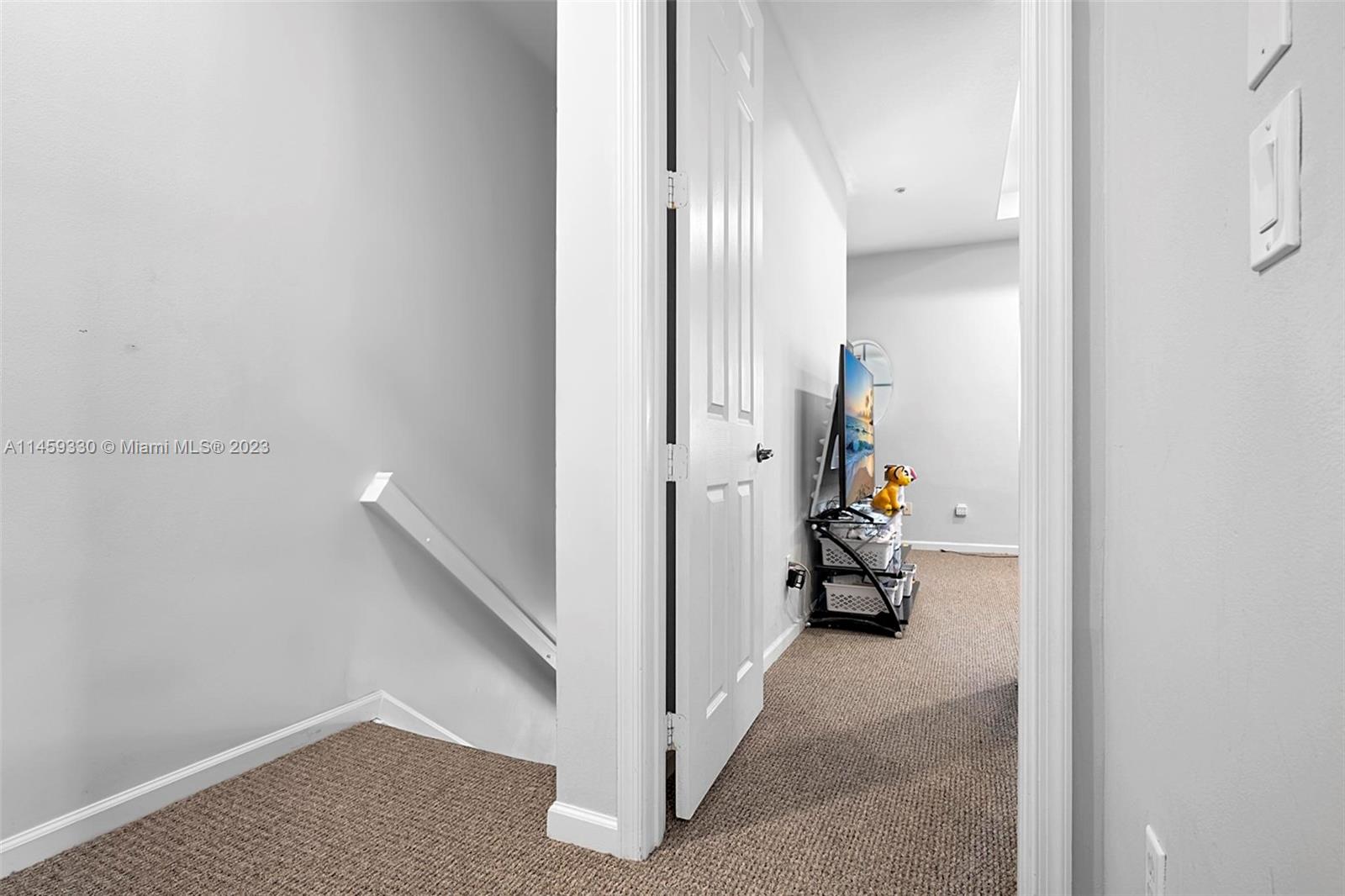 3920 Passion Flower Road Coconut Creek, FL 33073 - Photo 19 of 37 a view of a room with hallway and stairs