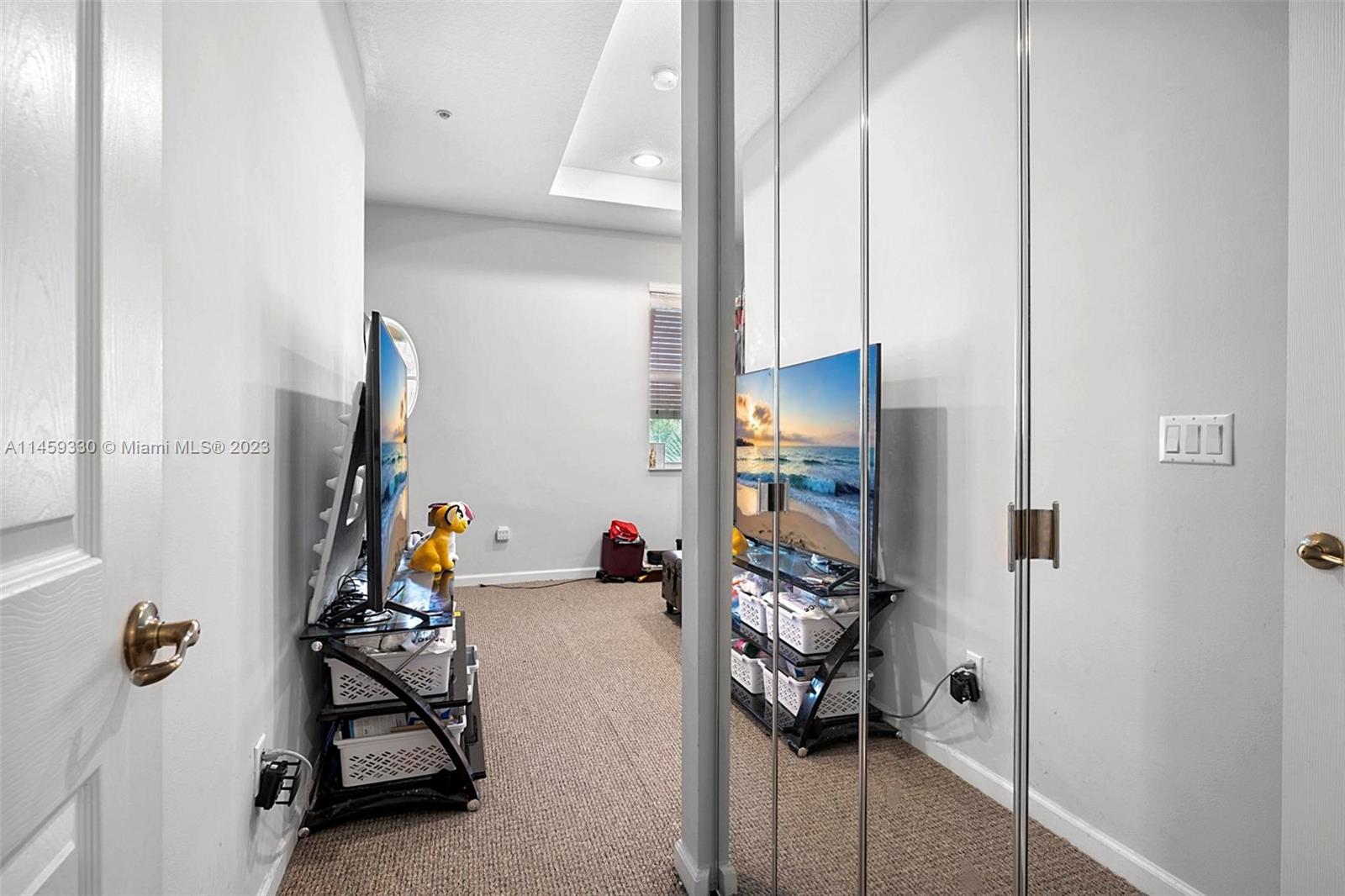 3920 Passion Flower Road Coconut Creek, FL 33073 - Photo 20 of 37 a view of kids room with toys and a mirror