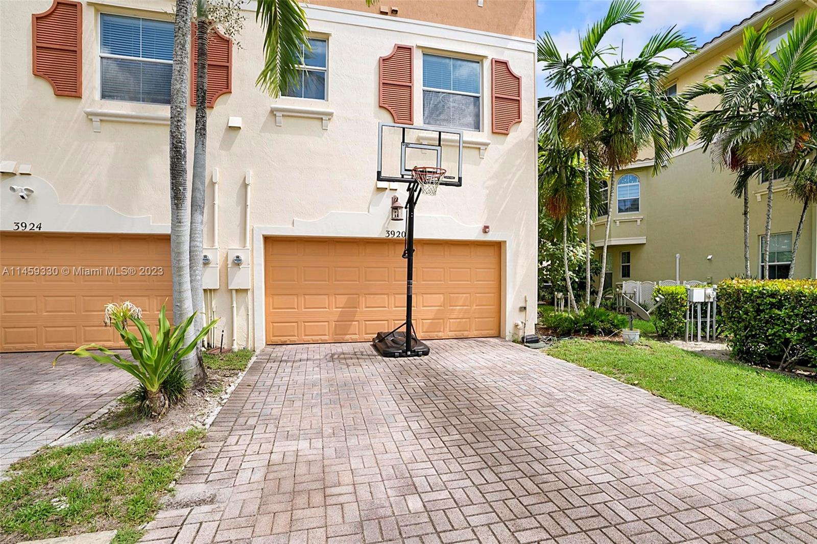 3920 Passion Flower Road Coconut Creek, FL 33073 - Photo 26 of 37 a view of a garden with pathway