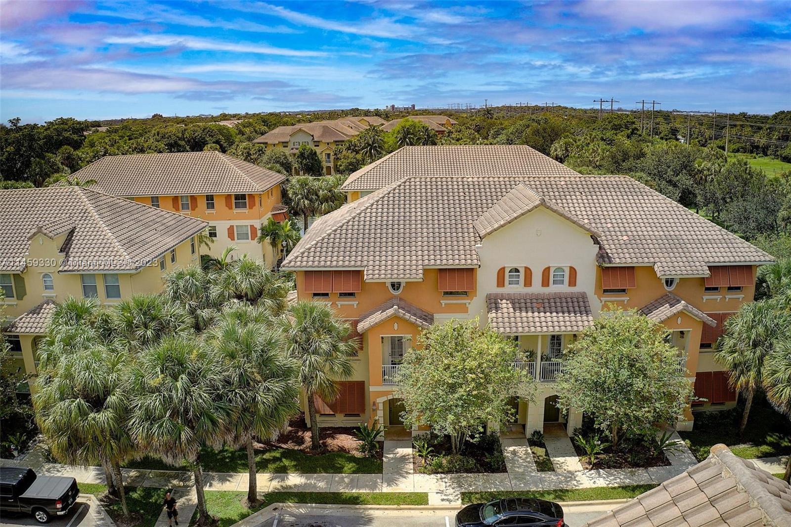 3920 Passion Flower Road Coconut Creek, FL 33073 - Photo 29 of 37 an aerial view of multiple house