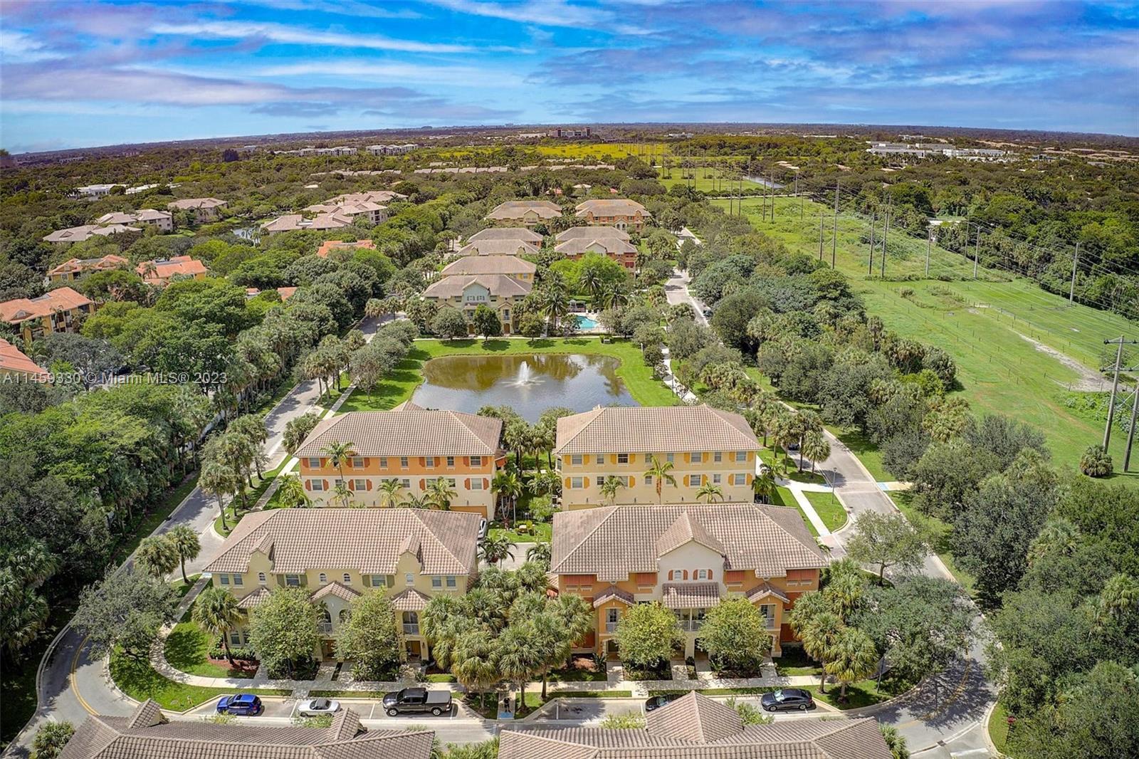 3920 Passion Flower Road Coconut Creek, FL 33073 - Photo 30 of 37 a view of a city with an ocean