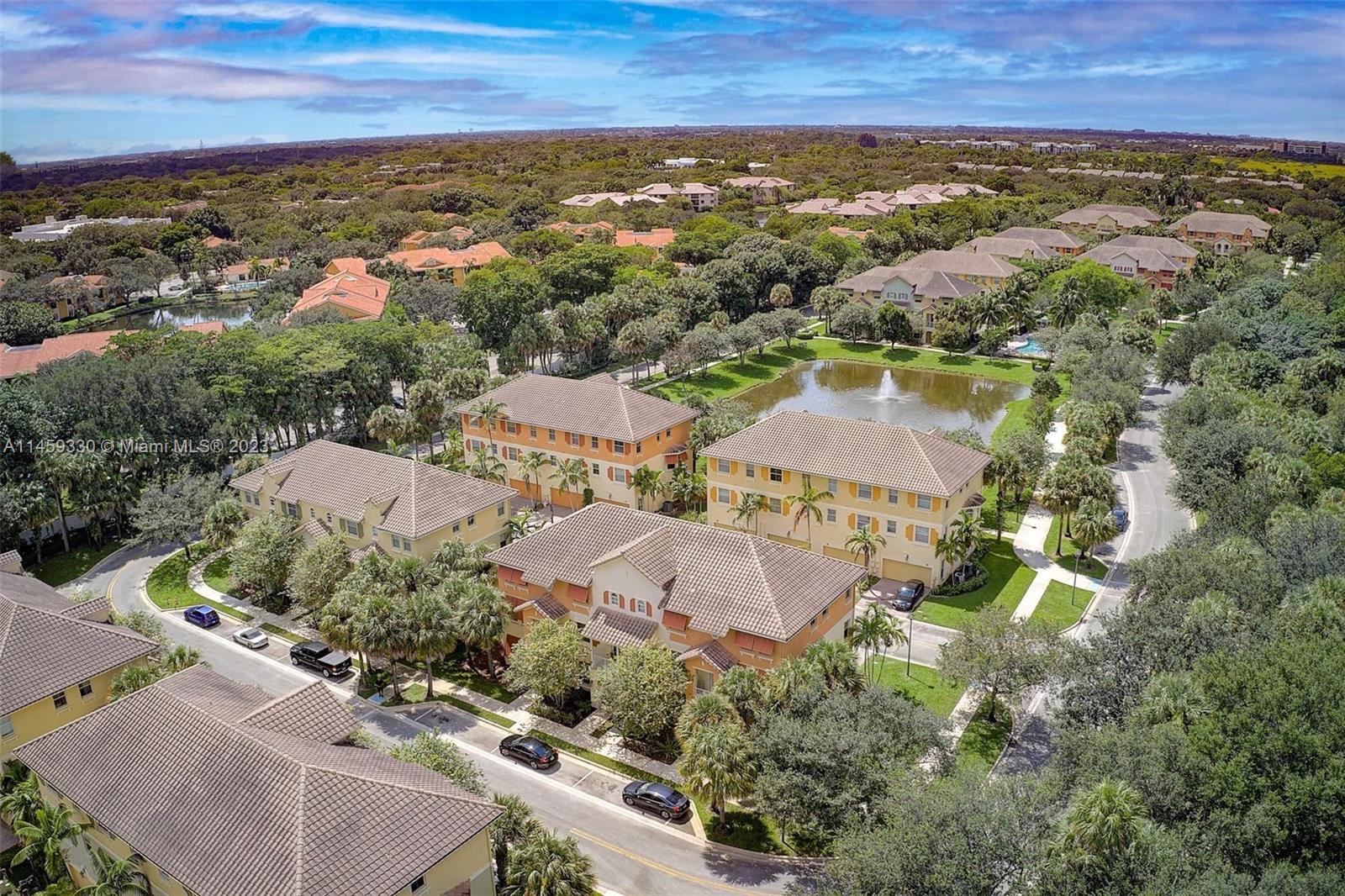 3920 Passion Flower Road Coconut Creek, FL 33073 - Photo 31 of 37 an aerial view of residential houses with outdoor space and trees